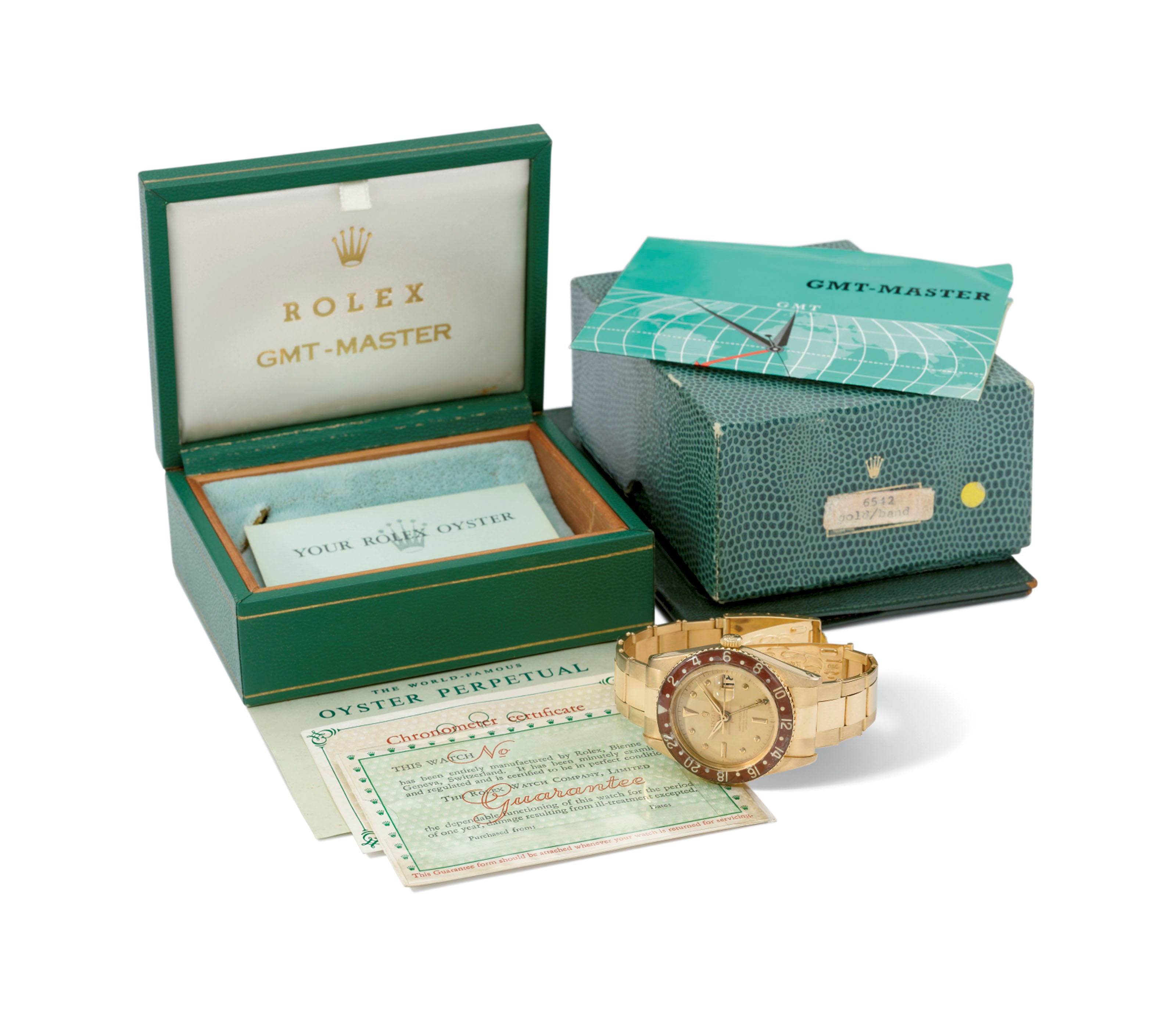 Rolex. A very rare and attractive 18K gold automatic dual time wristwatch with champagne dial, sweep centre seconds, date, bakelite bezel and bracelet