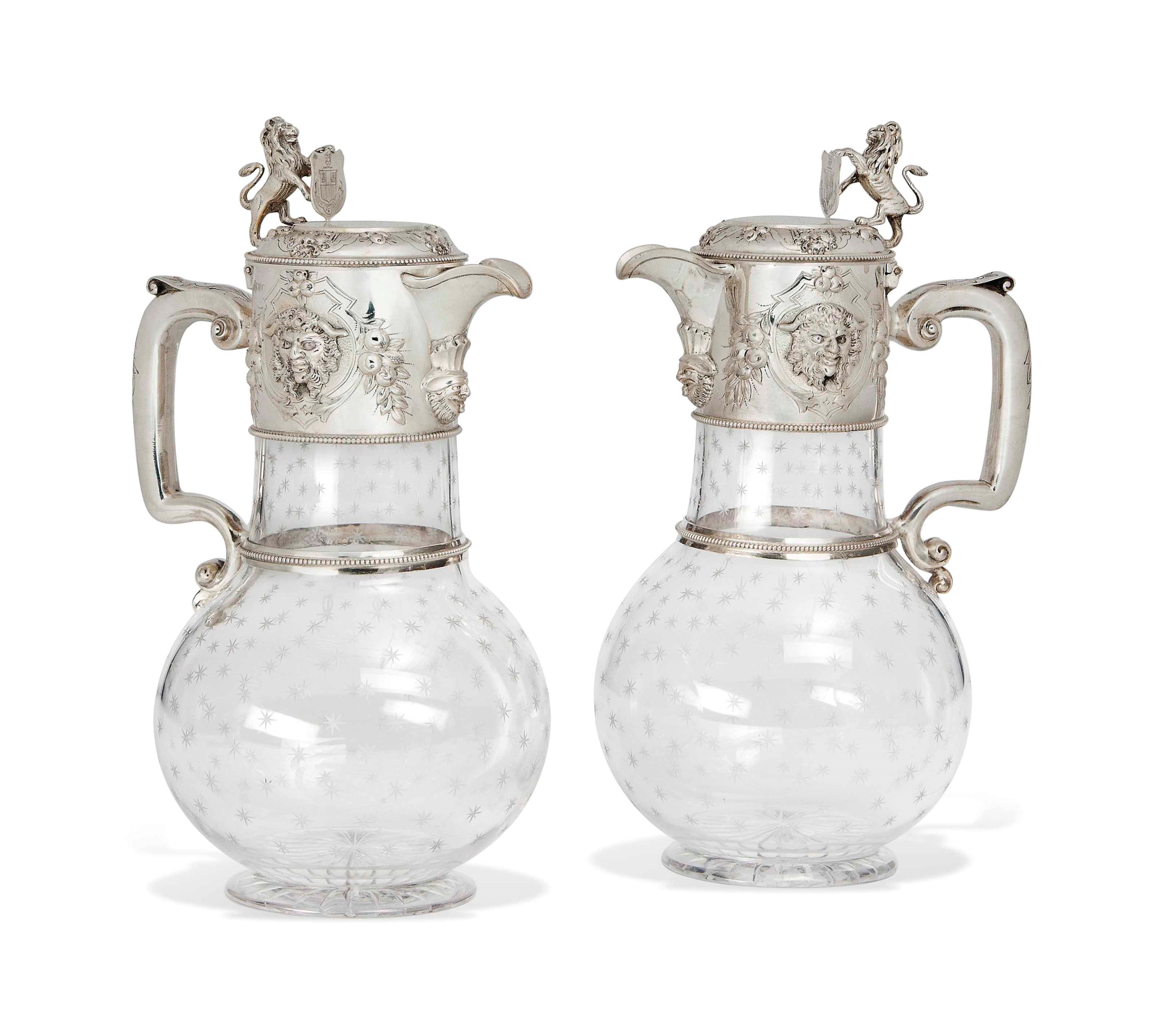 A PAIR OF VICTORIAN SILVER-MOUNTED GLASS CLARET JUGS