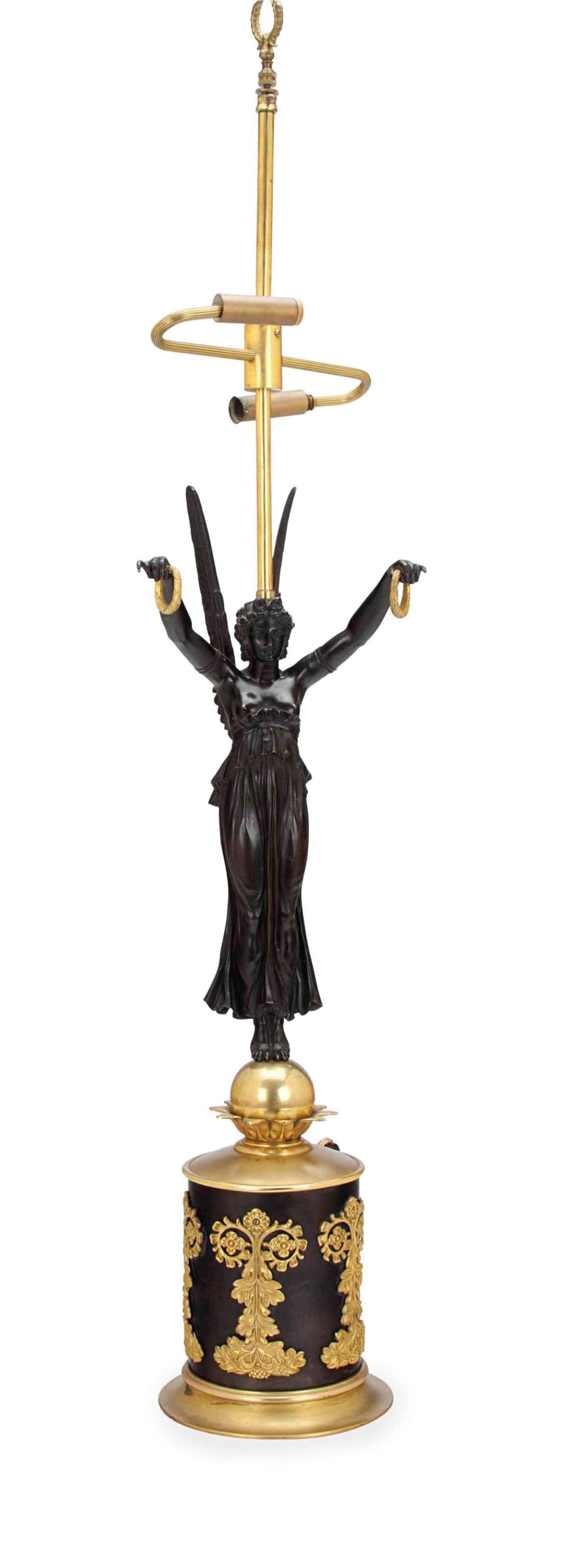 AN EMPIRE STYLE PATINATED AND GILT BRONZE FIGURAL TABLE LAMP,