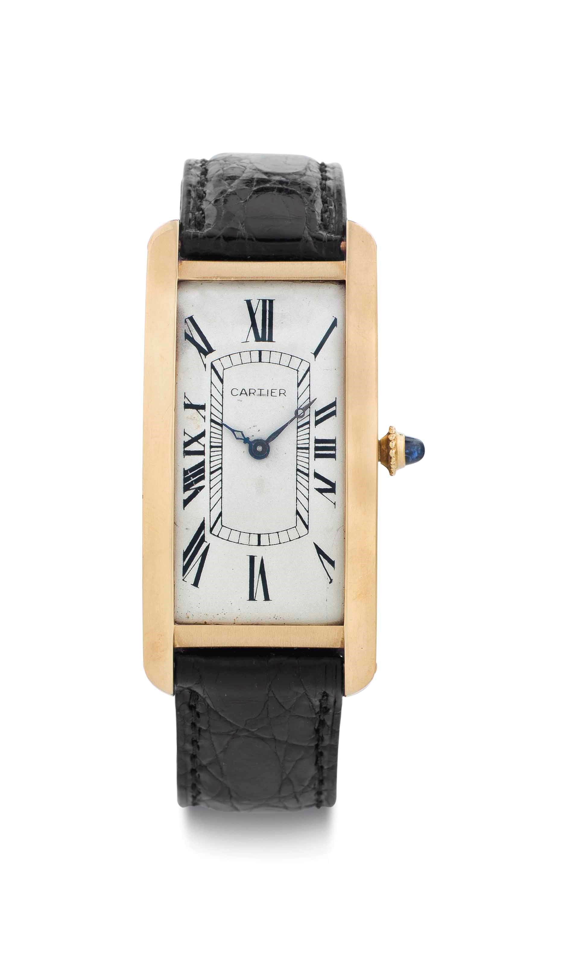 Cartier. A Rare and Oversized 18k Gold Rectangular Curved Wristwatch
