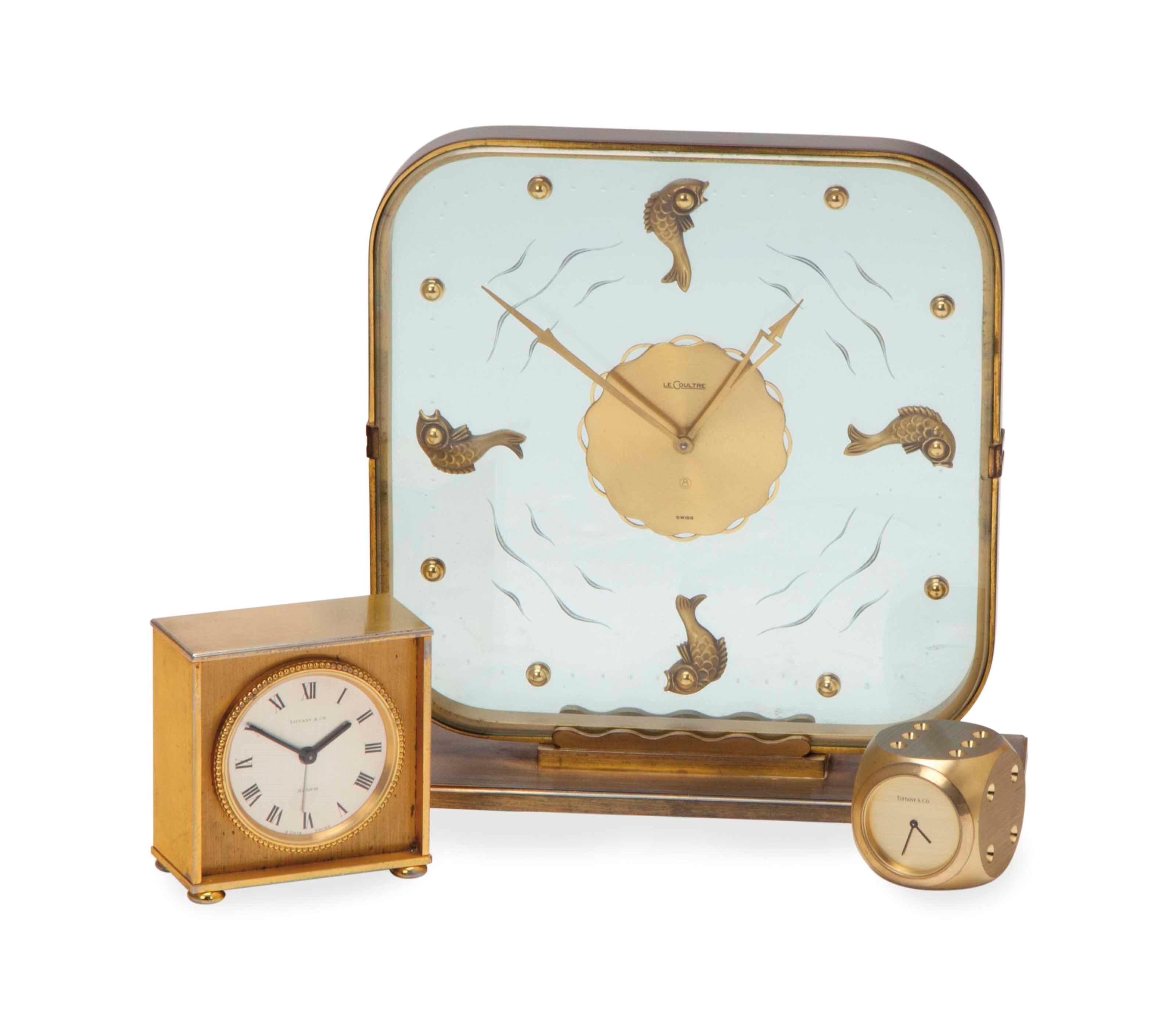 A SWISS GILT BRASS AND GLASS 'MYSTERY' CLOCK,