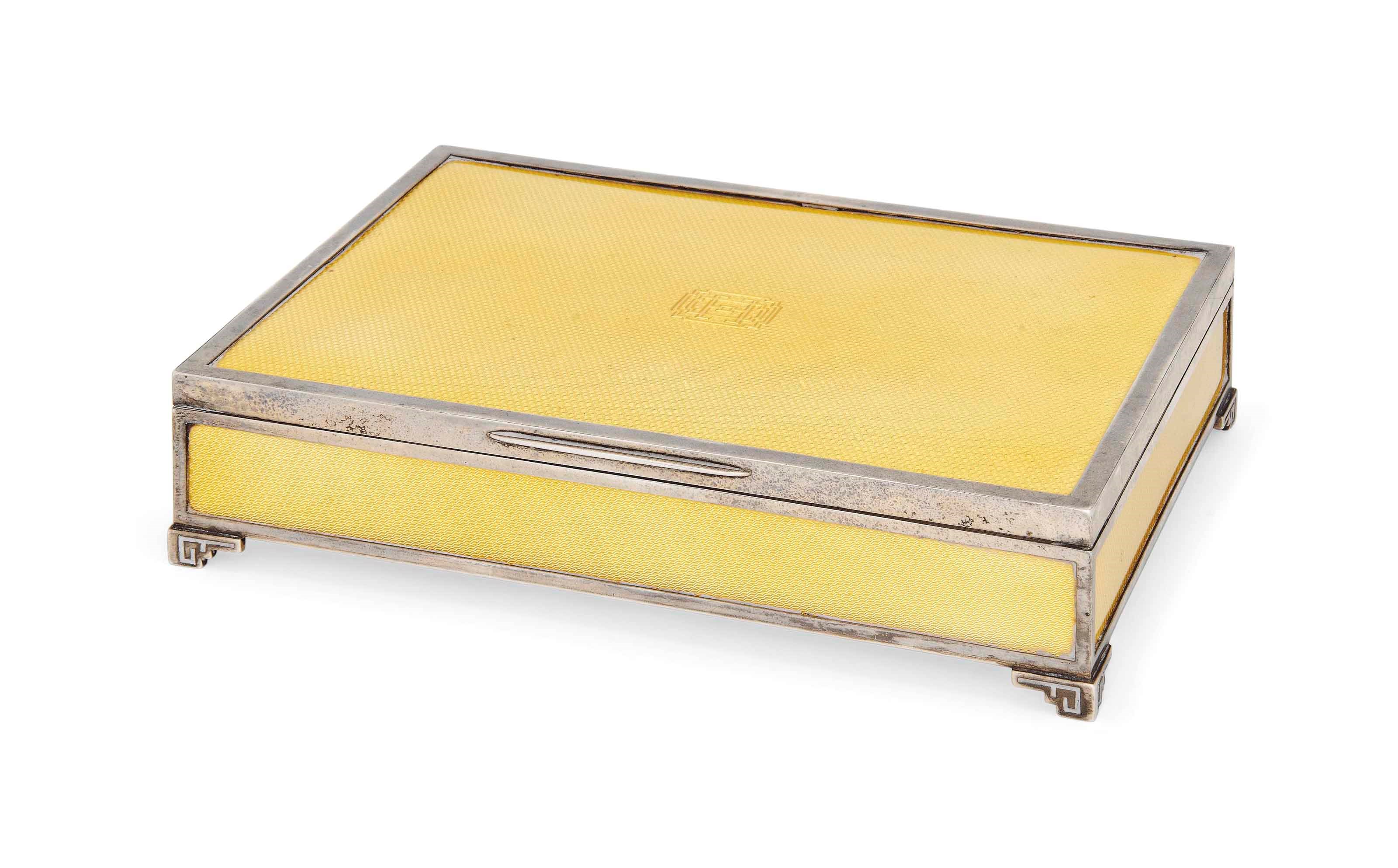A SILVER AND YELLOW ENAMEL BOX