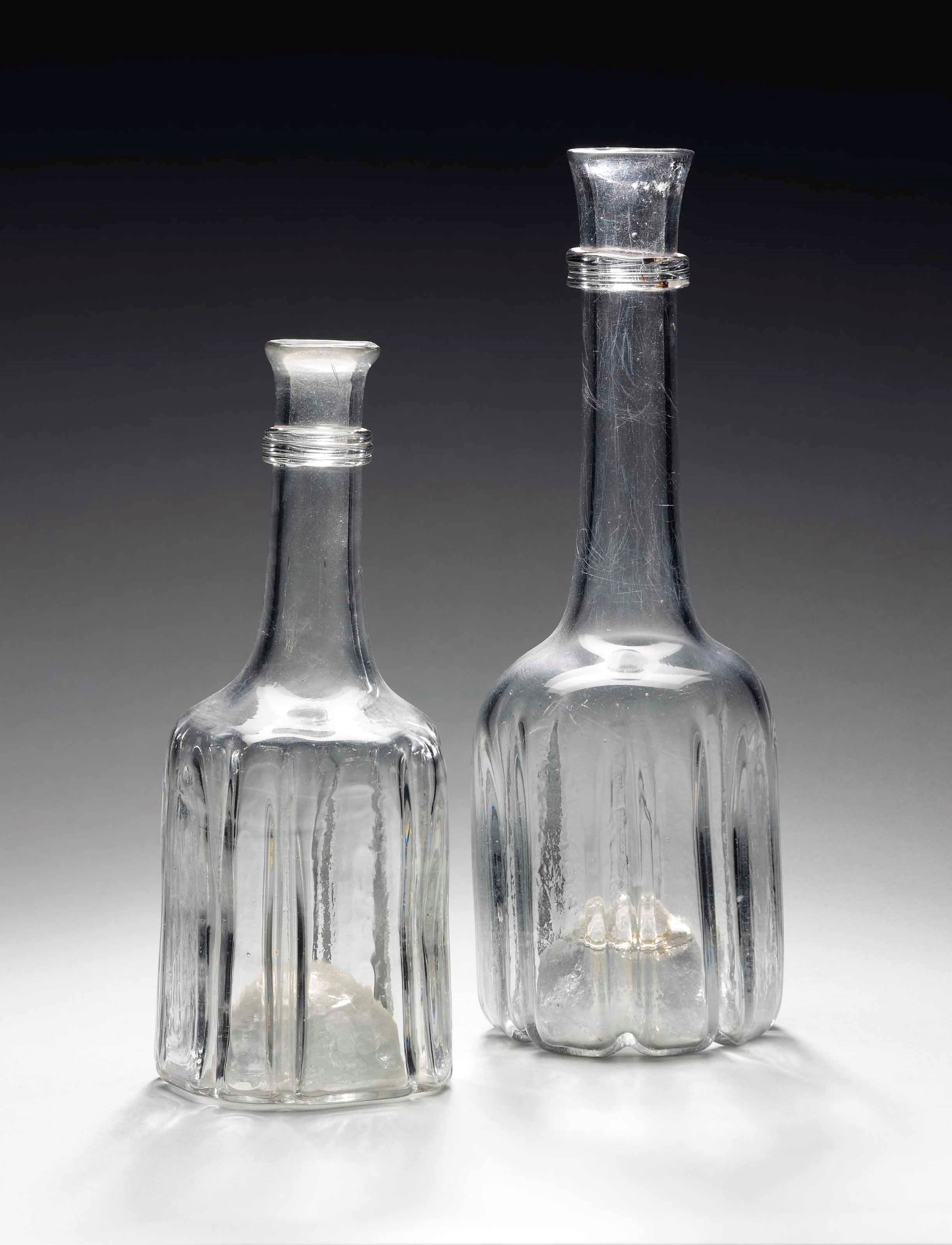 TWO ENGLISH MOULDED-GLASS CARAFES