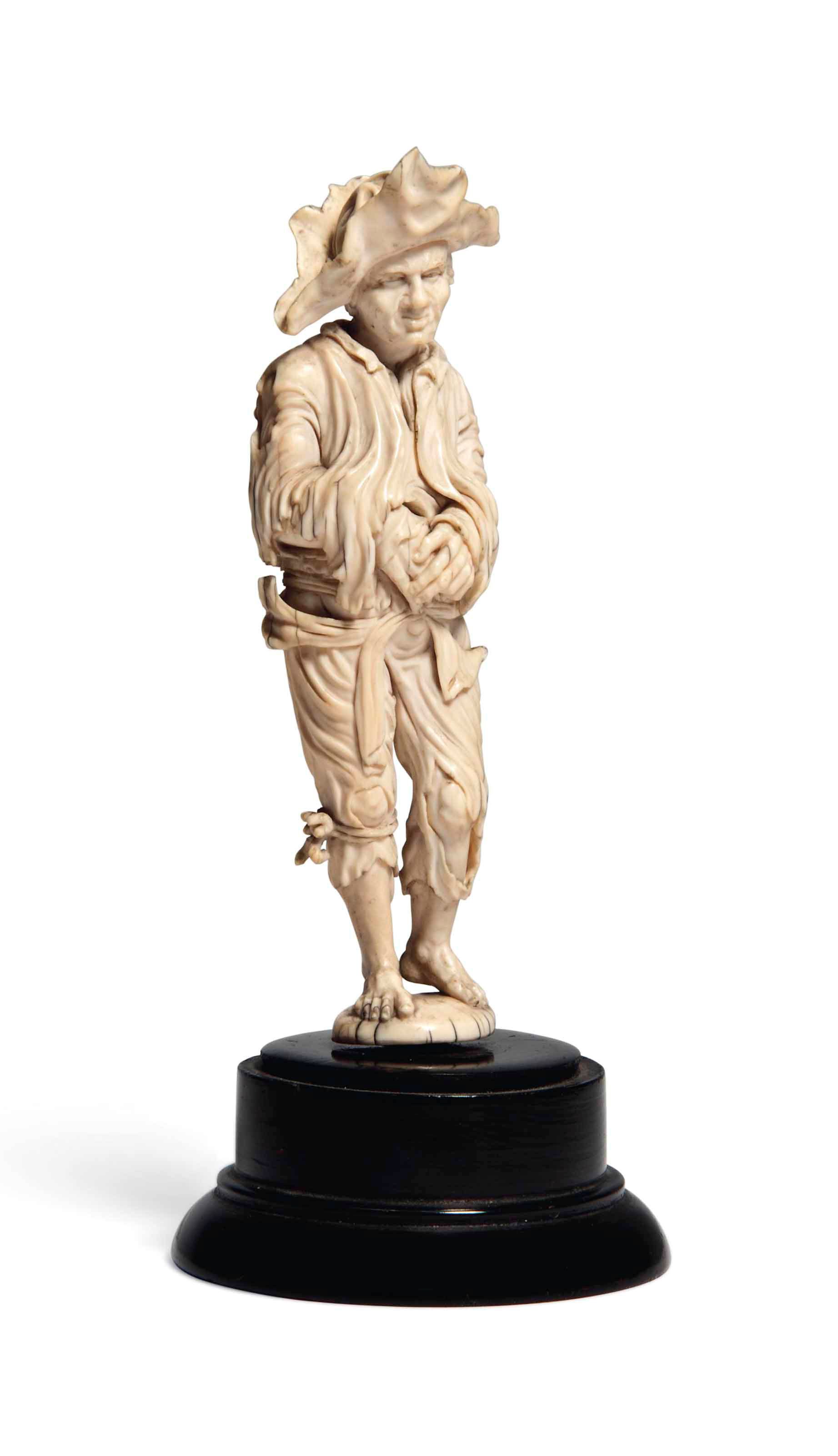 A GERMAN IVORY FIGURE OF A BEGGAR MAN