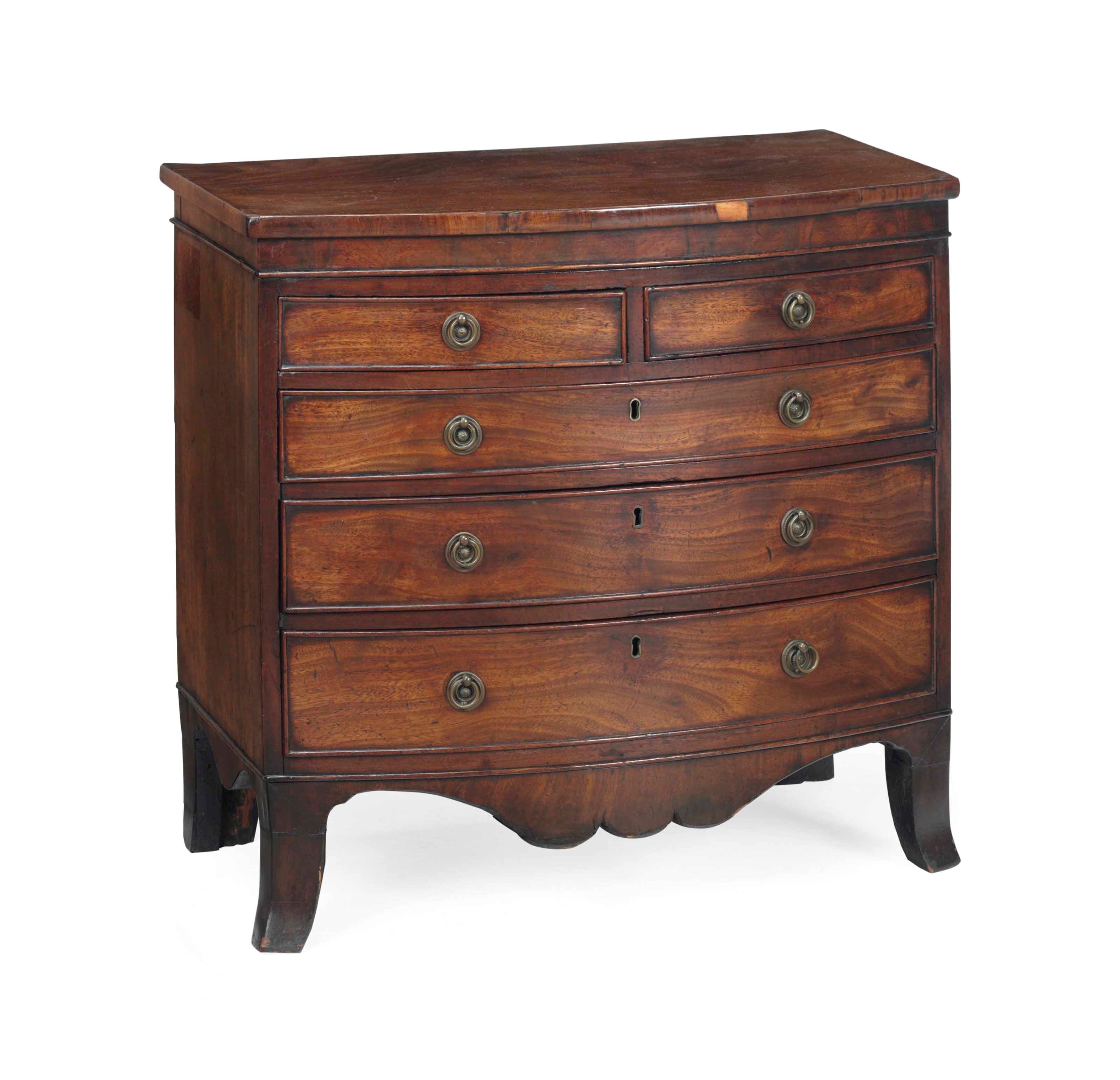 A GEORGE III MAHOGANY BOW-FRONT MINIATURE CHEST-OF-DRAWERS