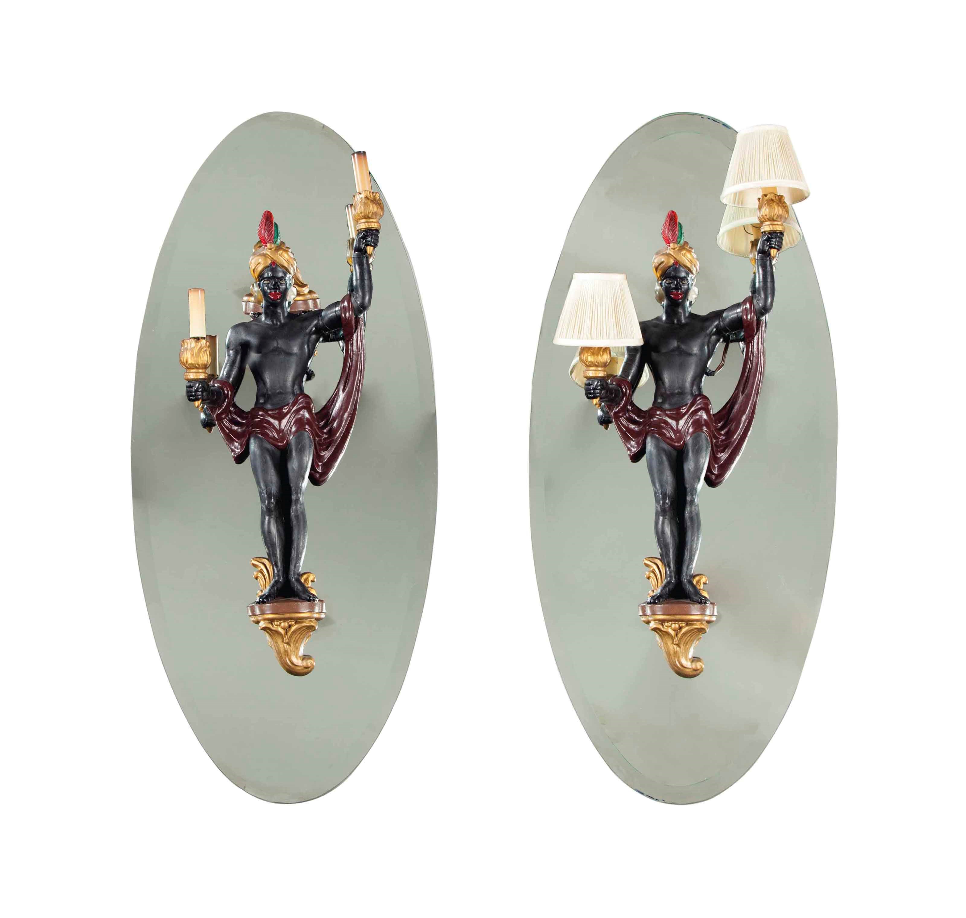 A SET OF FOUR PAINTED WOOD TWO-LIGHT WALL LIGHTS MODELED AS AFRICANS,