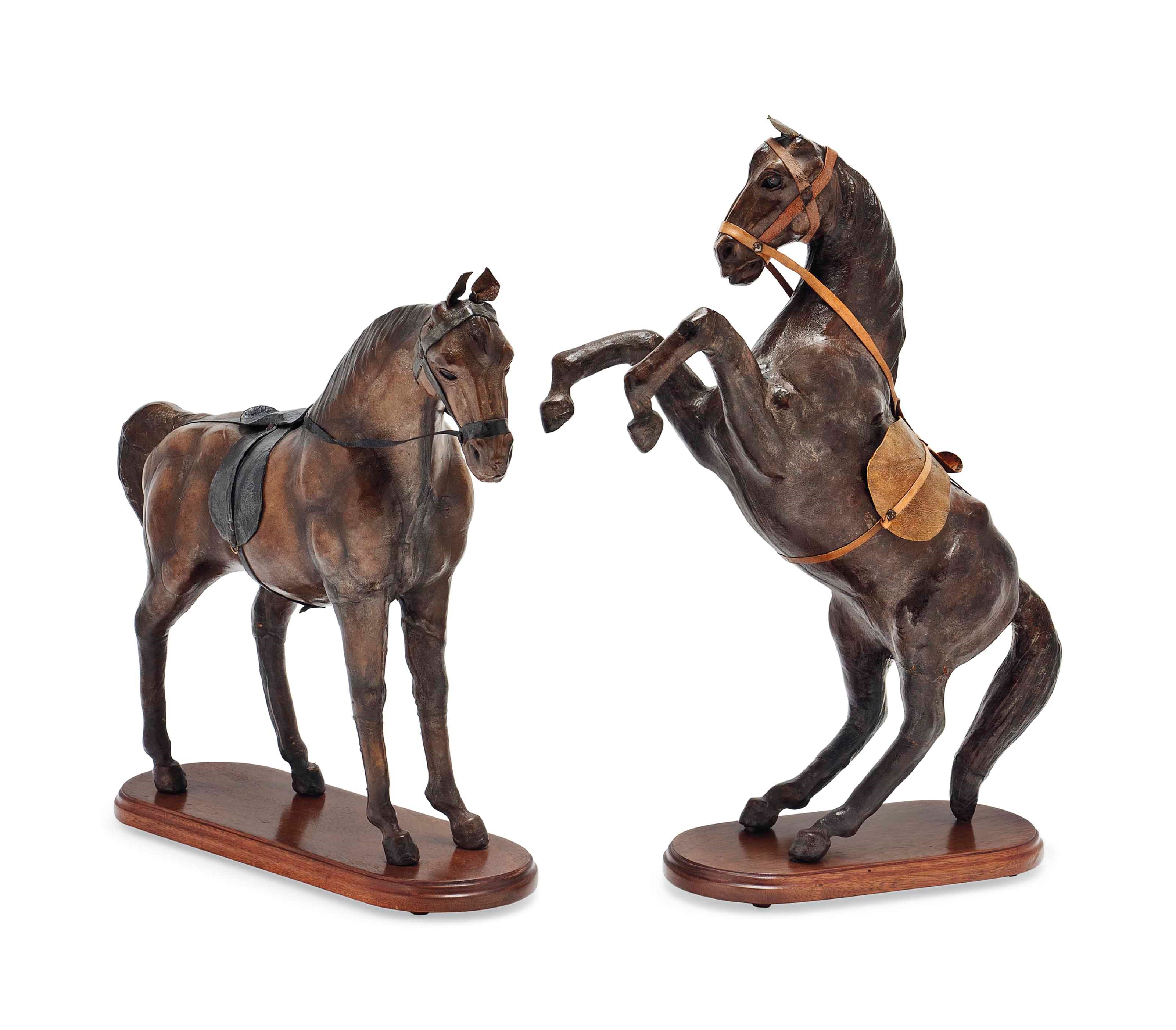 TWO LEATHER HIDE MODELS OF HORSES