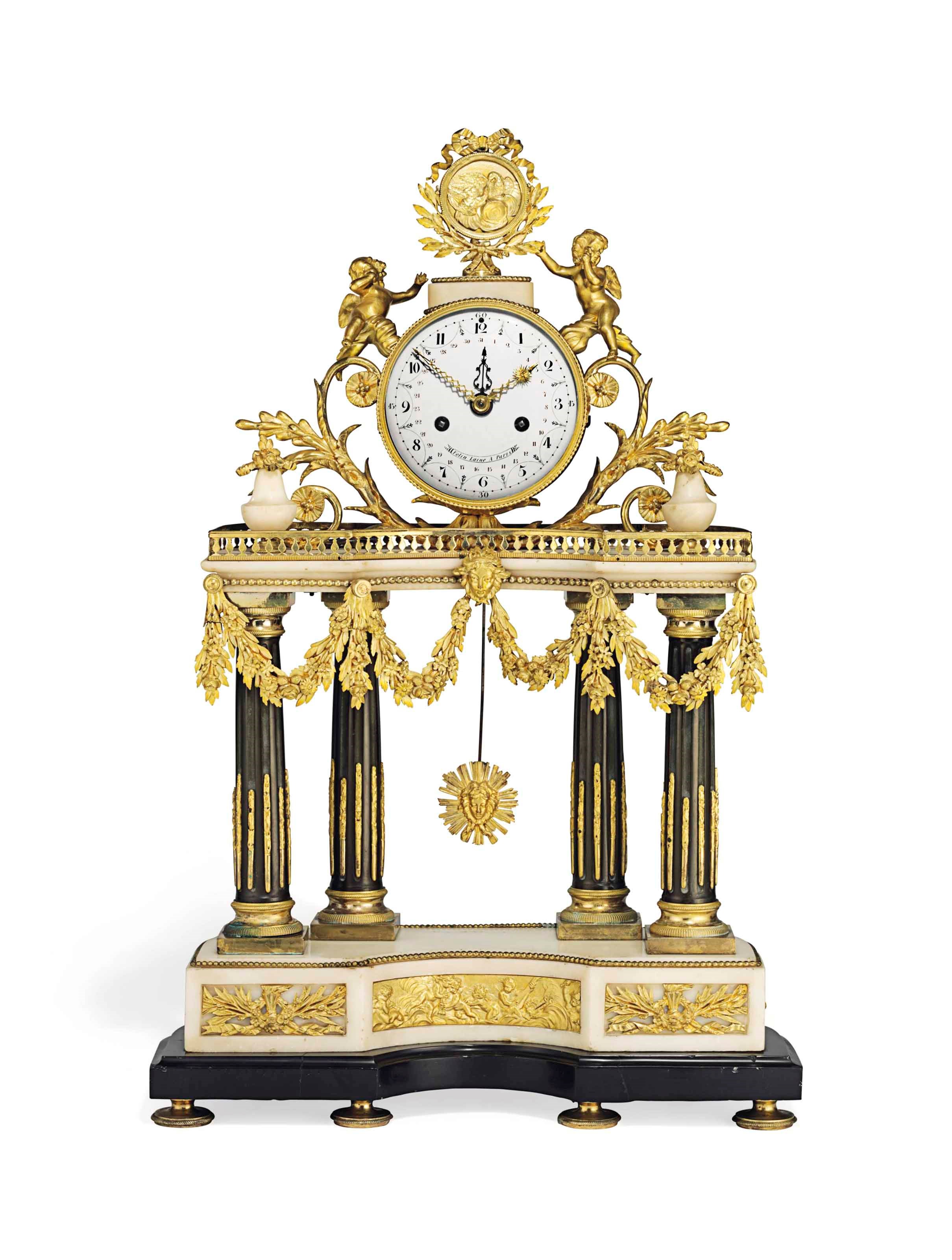A LOUIS XVI ORMOLU AND PATINATED BRONZE-MOUNTED BLACK AND WHITE MARBLE STRIKING PORTICO MANTEL CLOCK