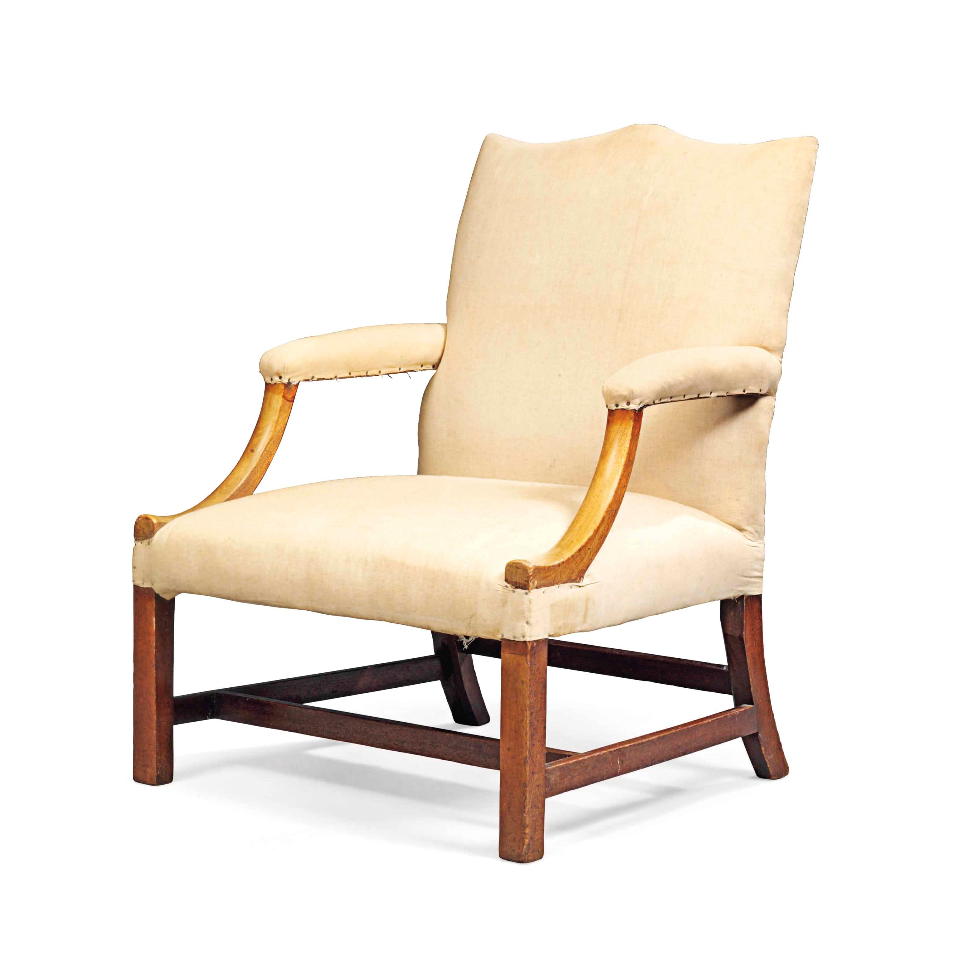 A GEORGE III MAHOGANY LIBRARY ARMCHAIR
