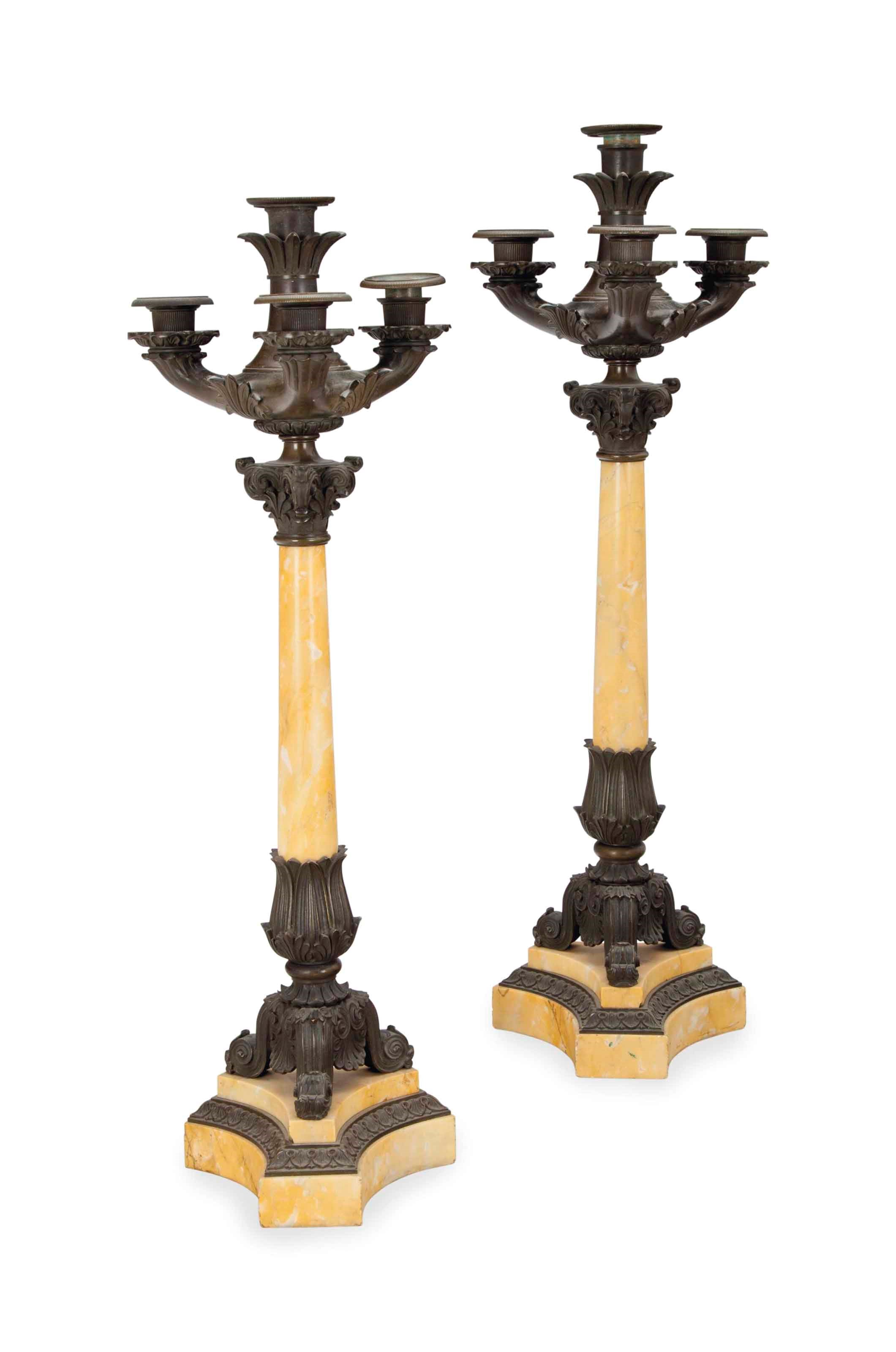 A PAIR OF LOUIS PHILLIPE PATINATED BRONZE AND MARBLE FOUR-LIGHT CANDELABRA,