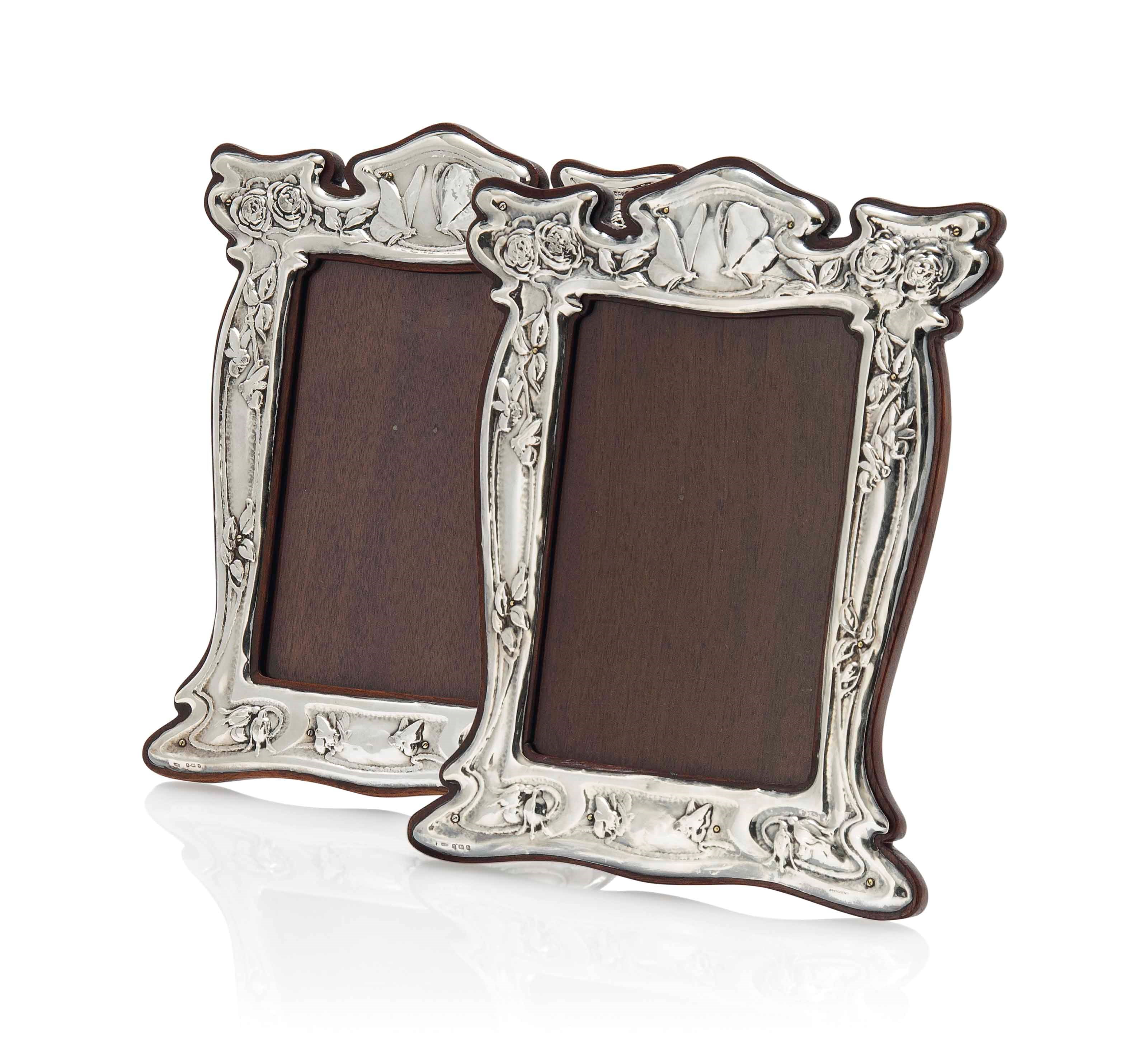 A J. AITKEN & SONS MATCHED PAIR OF SILVER AND MAHOGANY PHOTOGRAPH FRAMES