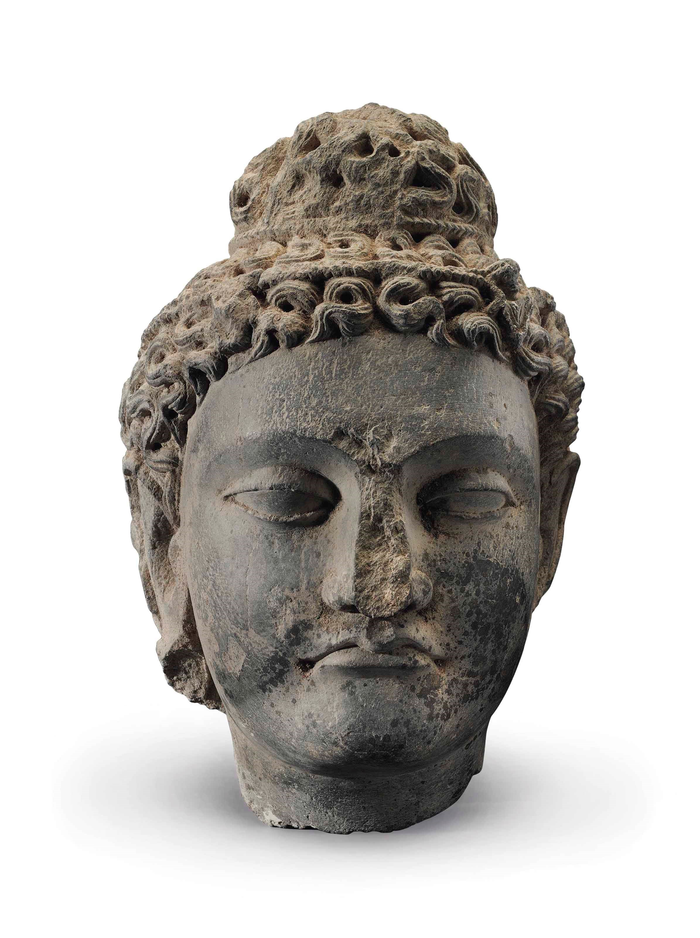 A gray schist head of a bodhisattva