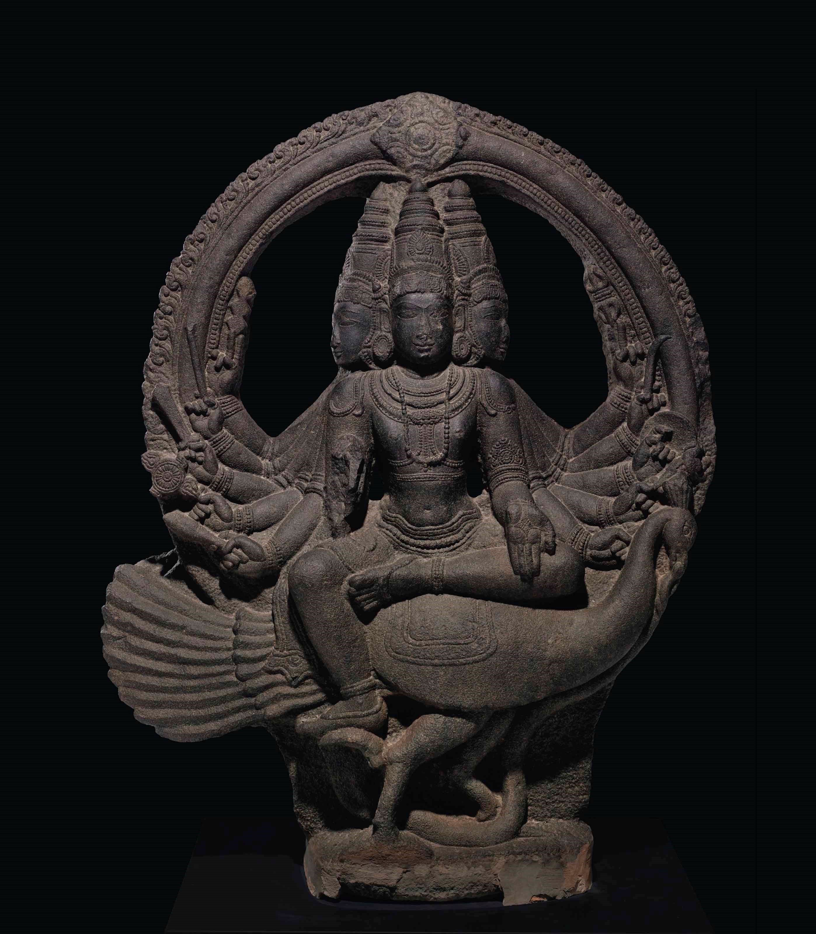 A monumental granite figure of Shanmukha