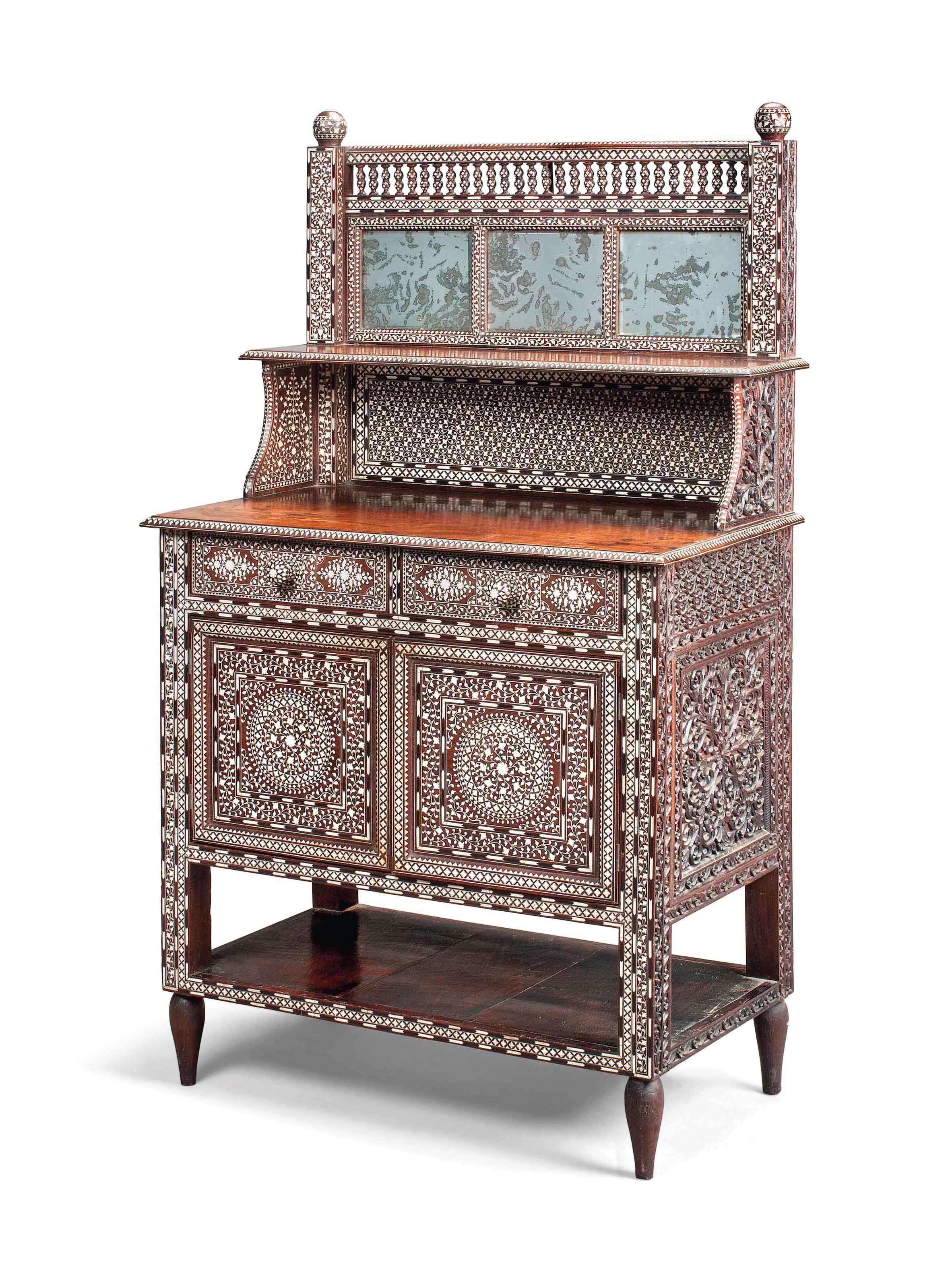 AN INDIAN BONE AND EBONY-INLAID AND CARVED ROSEWOOD SIDE CABINET