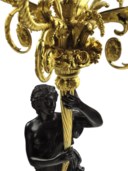 A PAIR OF LOUIS XVI ORMOLU-MOUNTED AND PATINATED BRONZE FOUR-LIGHT CANDELABRA