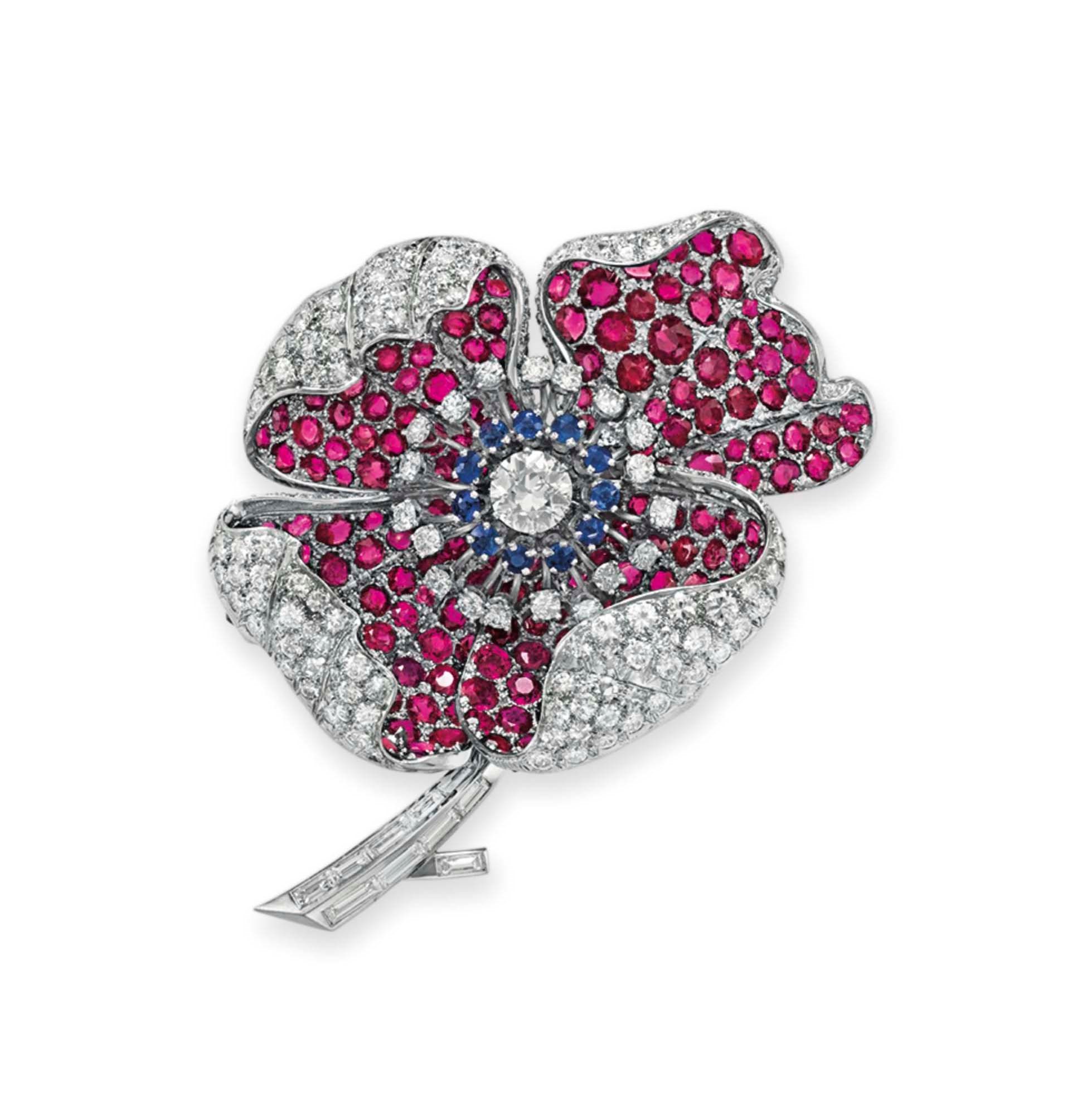 A DIAMOND, RUBY AND SAPPHIRE FLOWER BROOCH