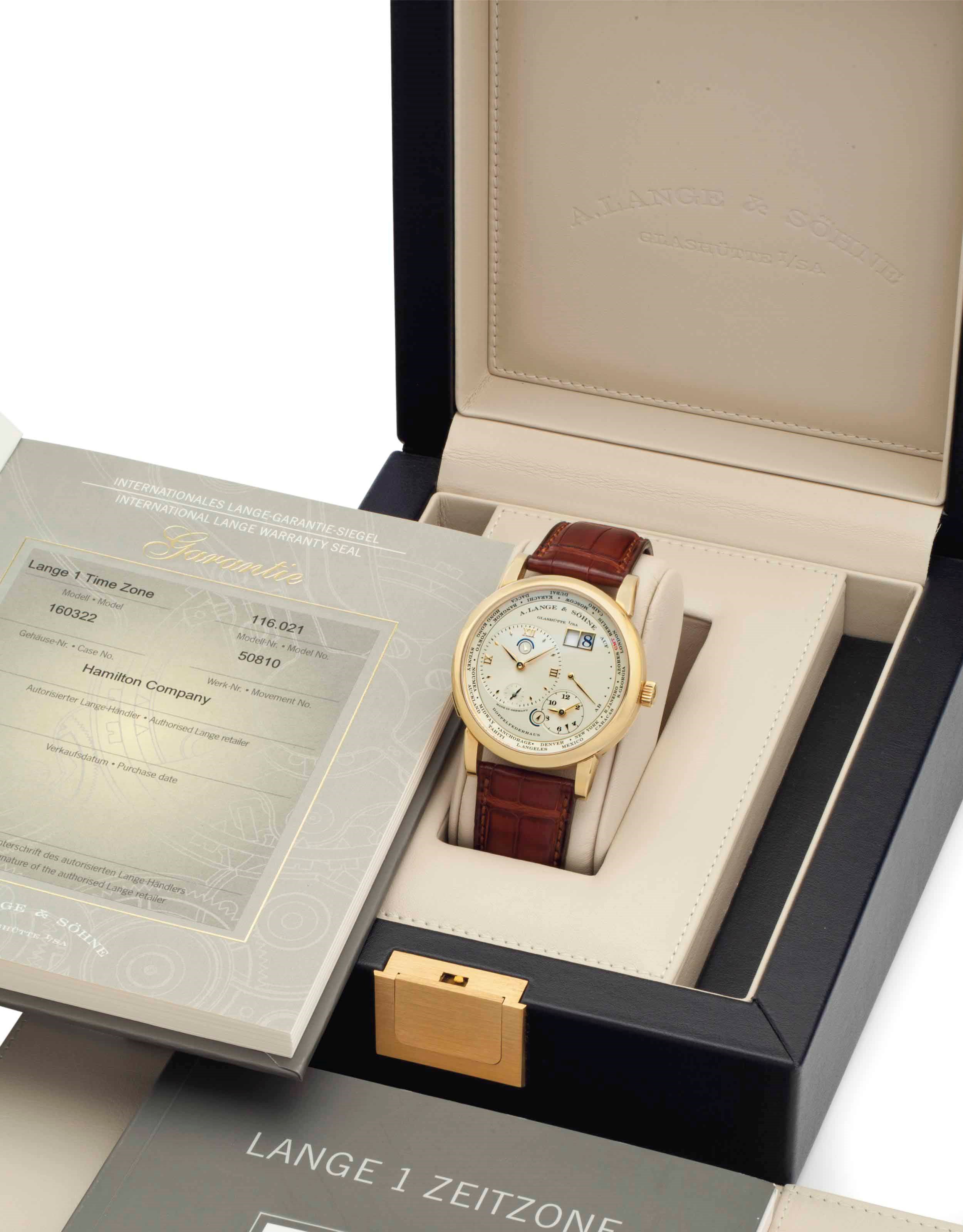 A. Lange & Söhne. A Very Fine and Rare 18k Gold Twin Barrel Two Time Zone World Time Wristwatch with Oversized Date, Day and Night Indication, and Power Reserve