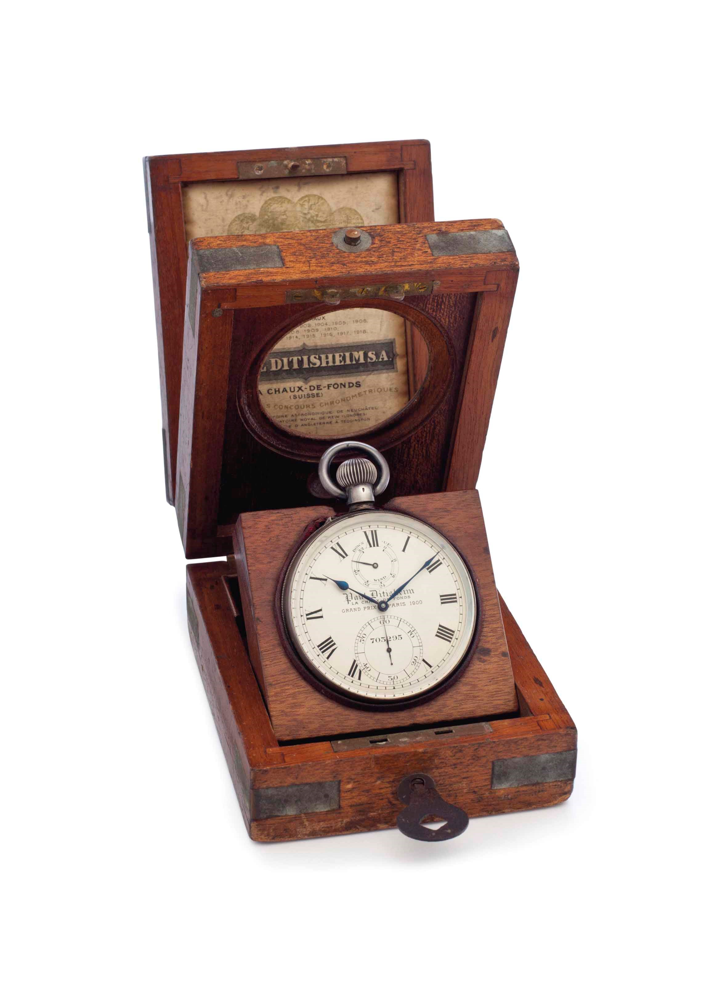Paul Ditisheim. A Rare Silver Openface Keyless Lever Deck Watch with Guillaume Balance, Up and Down Indication and Wooden Presentation Box