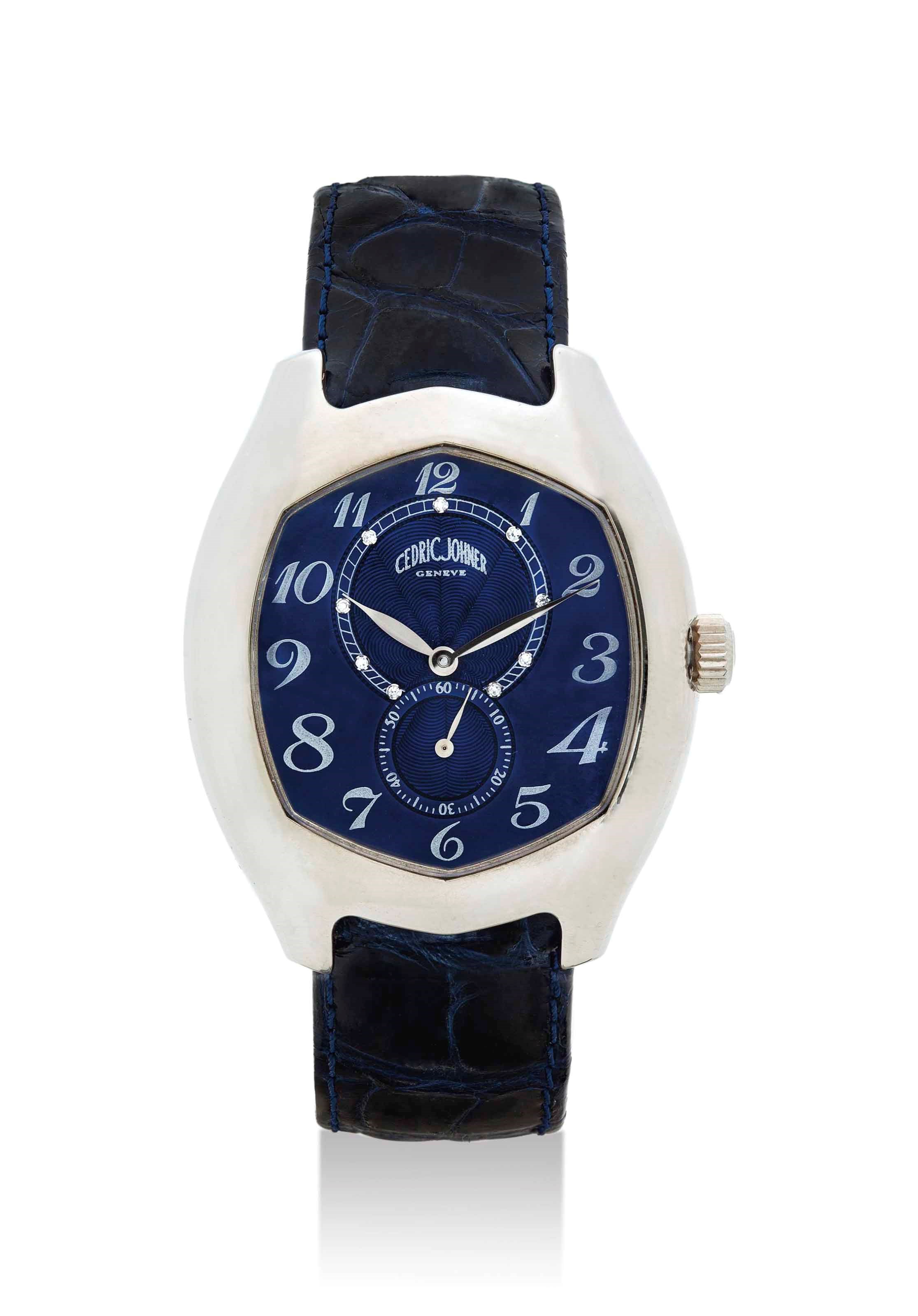 CÉDRIC JOHNER. AN 18K WHITE GOLD AUTOMATIC TONNEAU-SHAPED WRISTWATCH