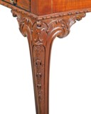 A GEORGE III FIDDLEBACK MAHOGANY WRITING-TABLE