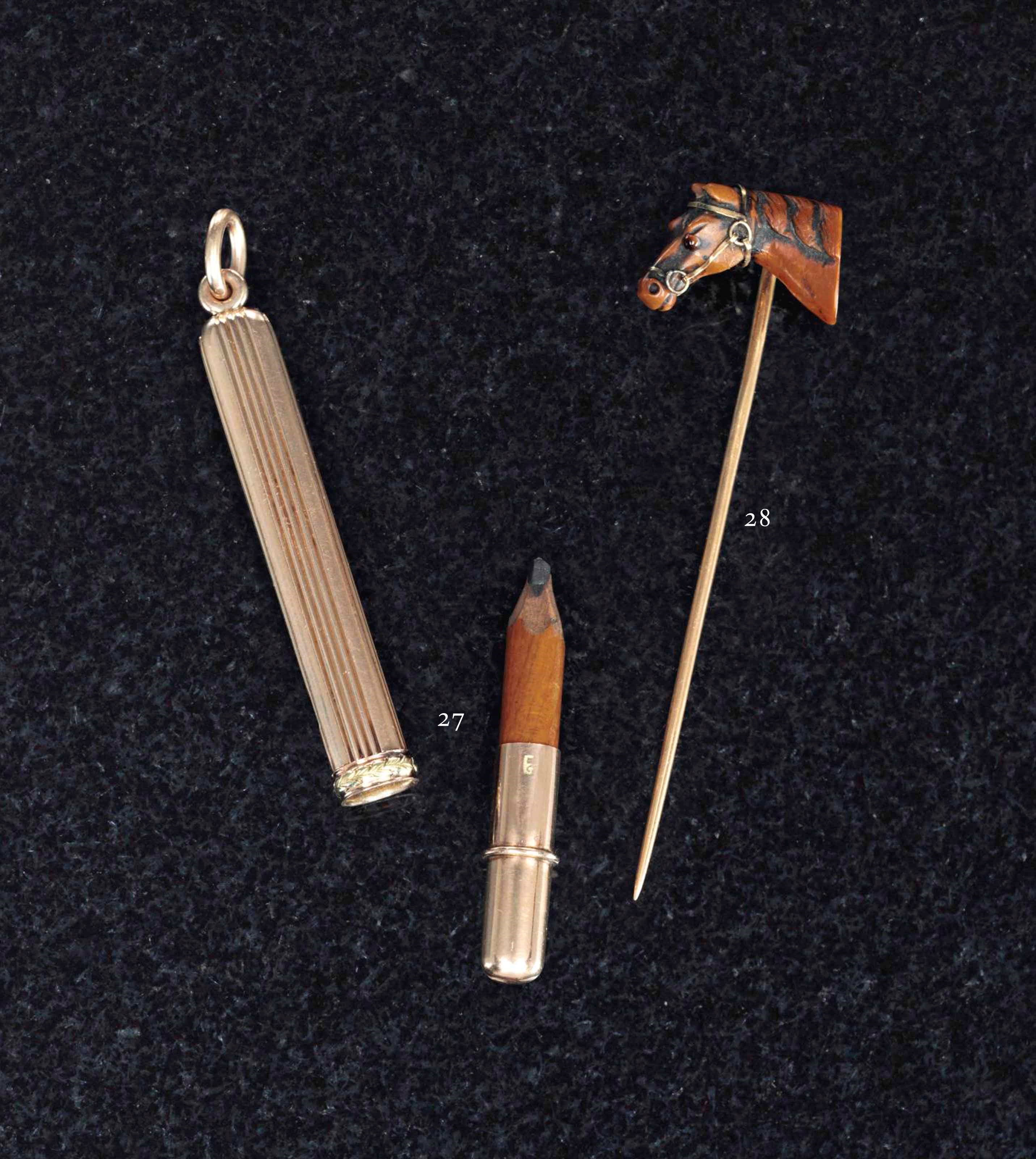 A GOLD AND COMPOSITION STICKPIN