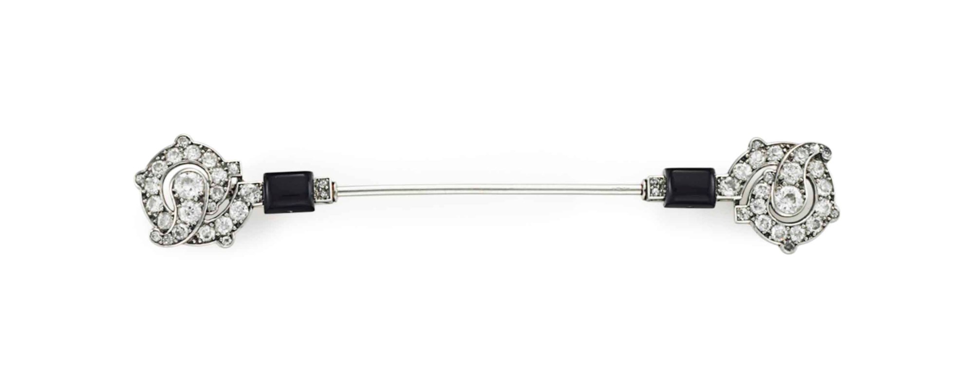 AN ART DECO DIAMOND AND ONYX JABOT BROOCH, BY CARTIER