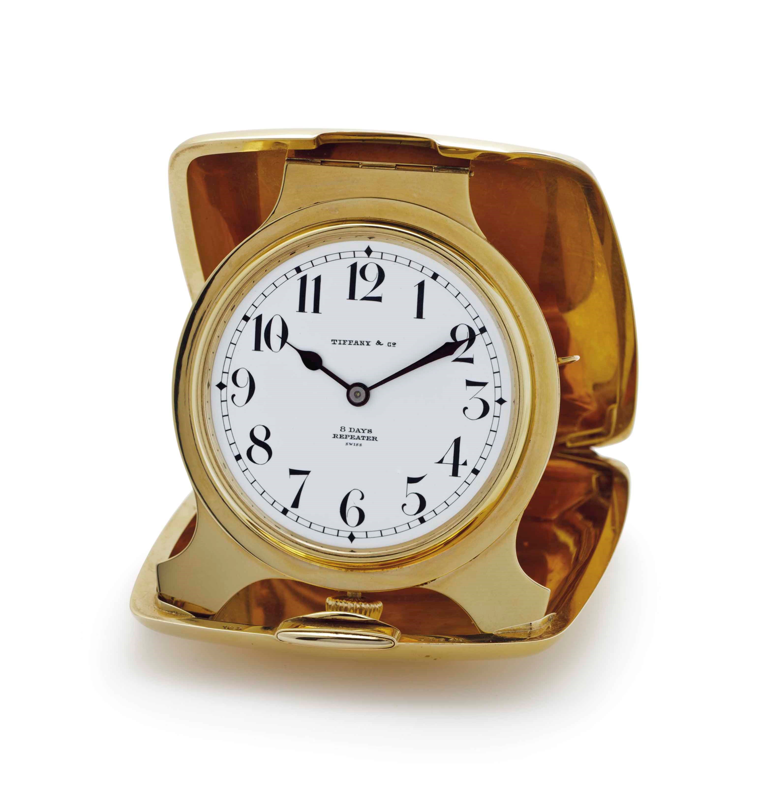 Tiffany and Wittnauer. An 18k Gold Quarter Repeating Folding Travel Clock with Presentation Box