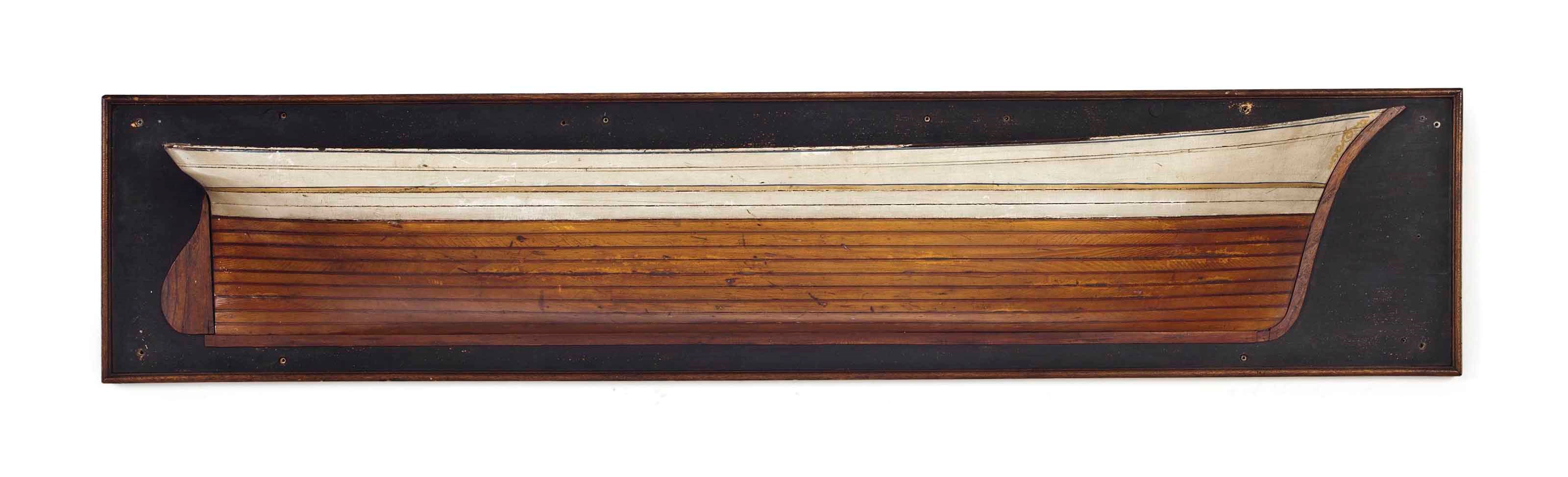 AN AMERICAN POLYCHROME-PAINTED, WALNUT AND OAK FRAMED HALF HULL MODEL OF A TENDER