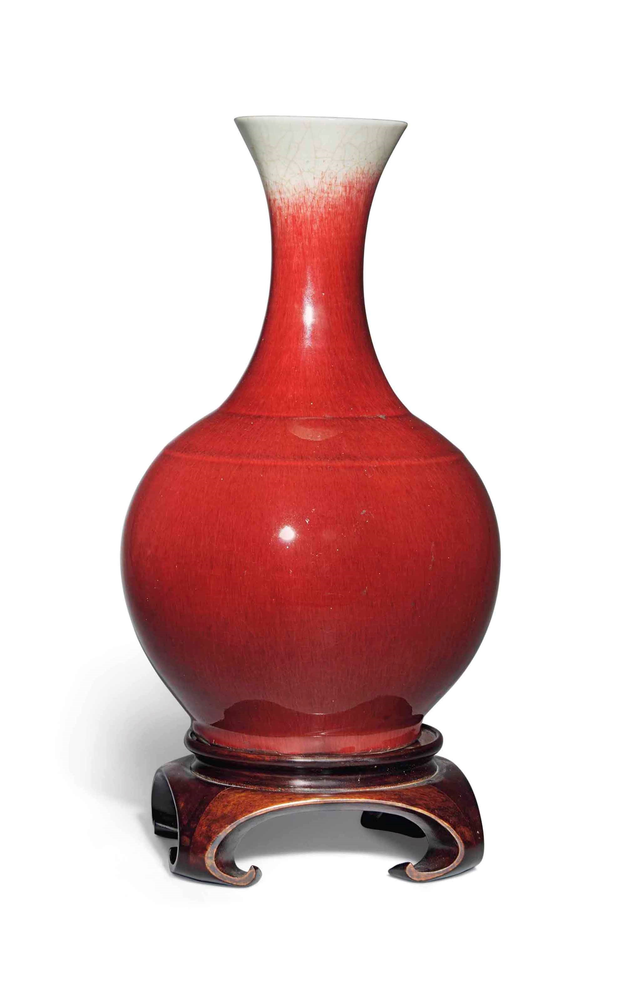 A CHINESE SANG DE BOEUF BOTTLE VASE