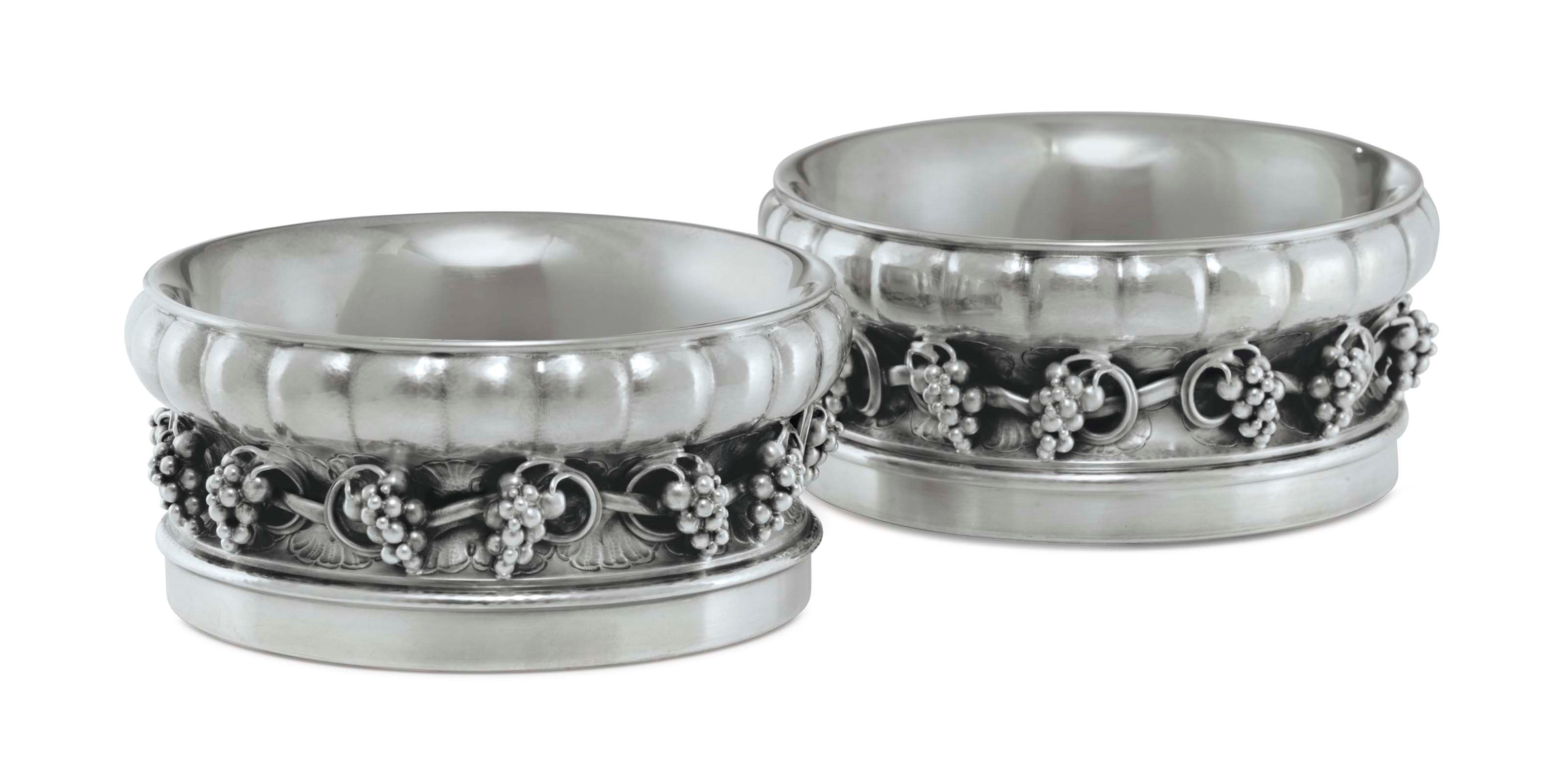 A PAIR OF DANISH SILVER WINE COASTERS, DESIGNED BY GEORG JENSEN
