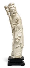 A CARVED IVORY FIGURE OF AN IMMORTAL