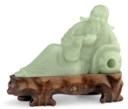 A CELADON JADE FIGURE OF LI TAIBO
