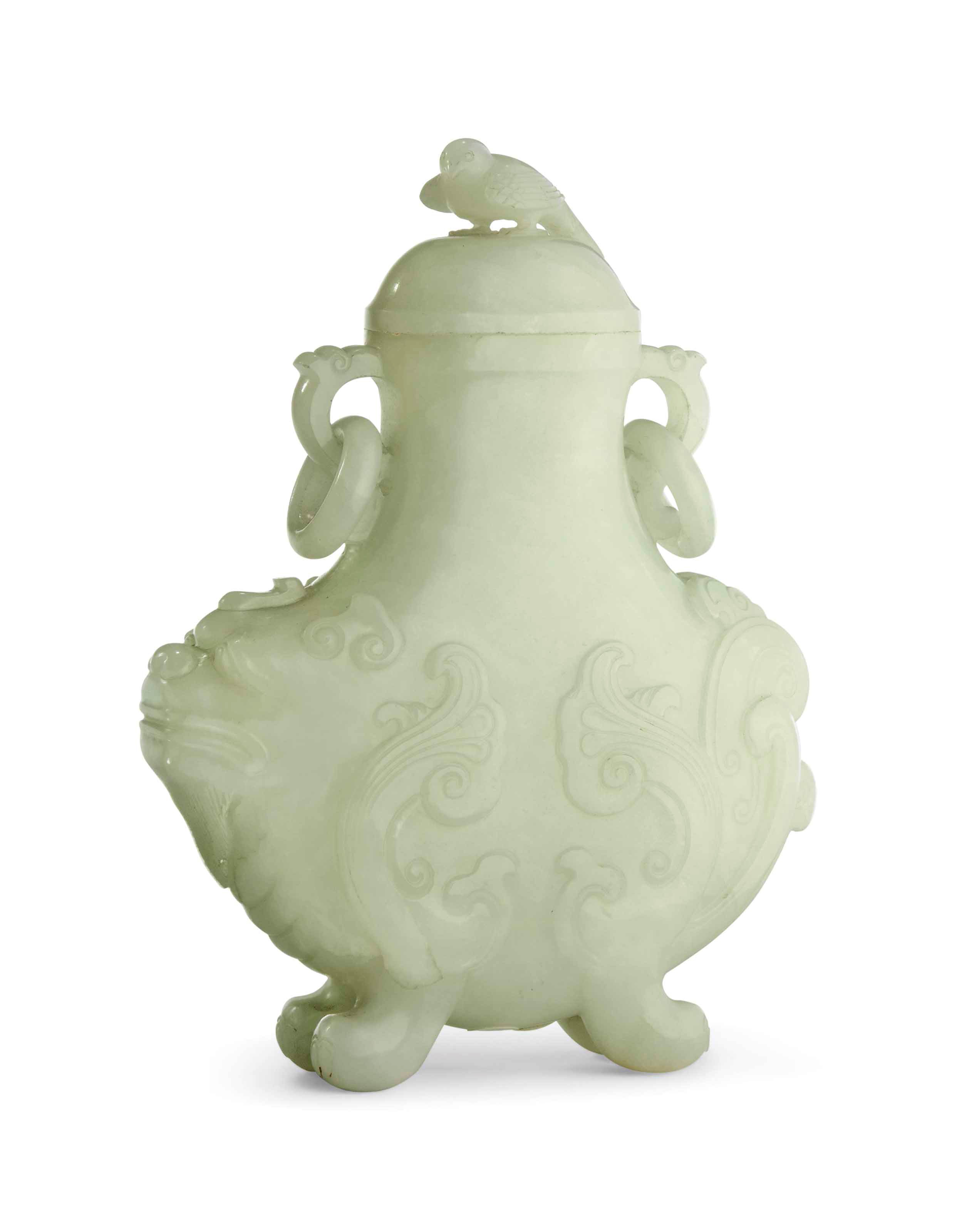 A PALE CELADON JADE 'MYTHICAL BEAST' VASE AND COVER