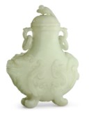 A PALE CELADON JADE 'MYTHICAL BEAST' VASE AND COVER