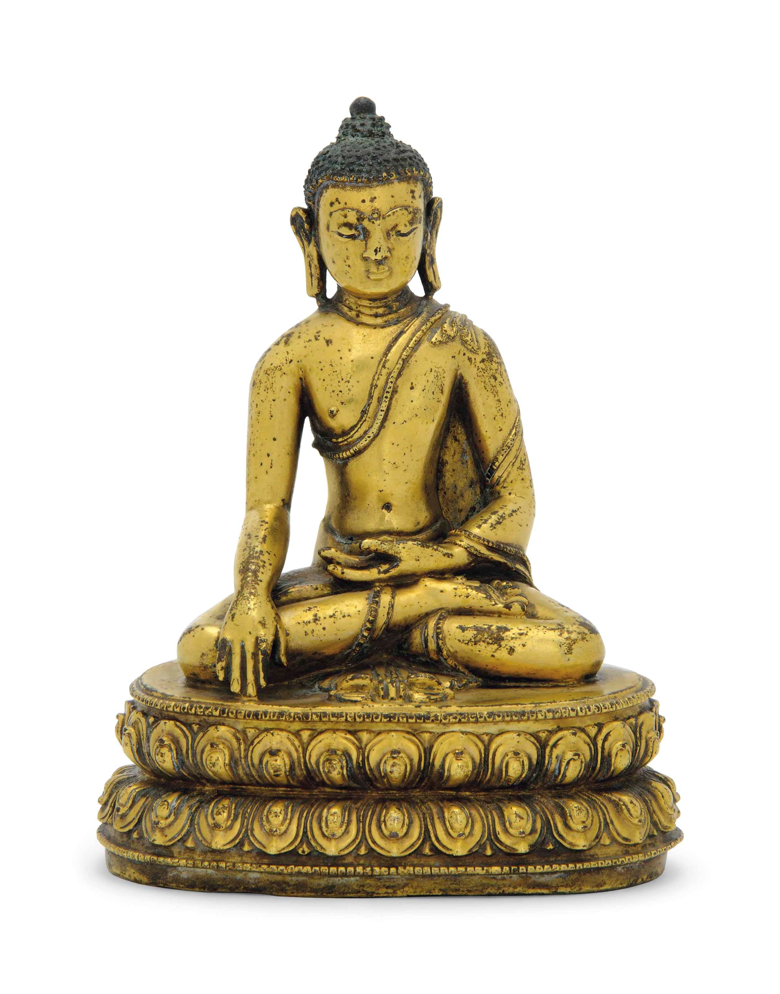 A GILT-BRONZE FIGURE OF BUDDHA AKSHOBYA