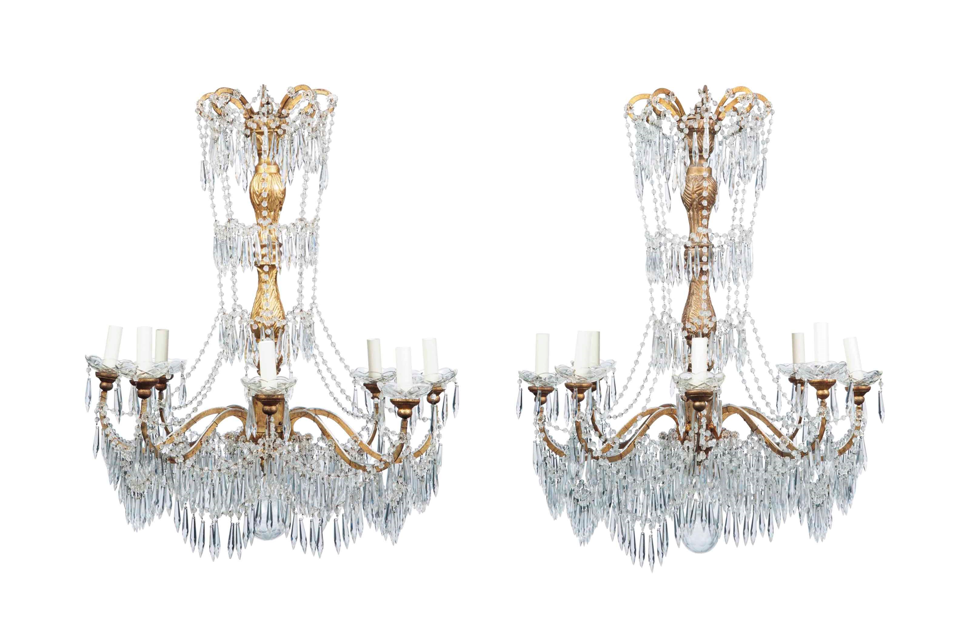 A PAIR OF ITALIAN GILT WOOD, METAL AND GLASS EIGHT BRANCH CHANDELIERS