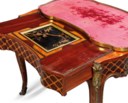 A LOUIS XV ORMOLU-MOUNTED AMARANTH, KINGWOOD AND TULIPWOOD PARQUETRY TABLE A ECRIRE