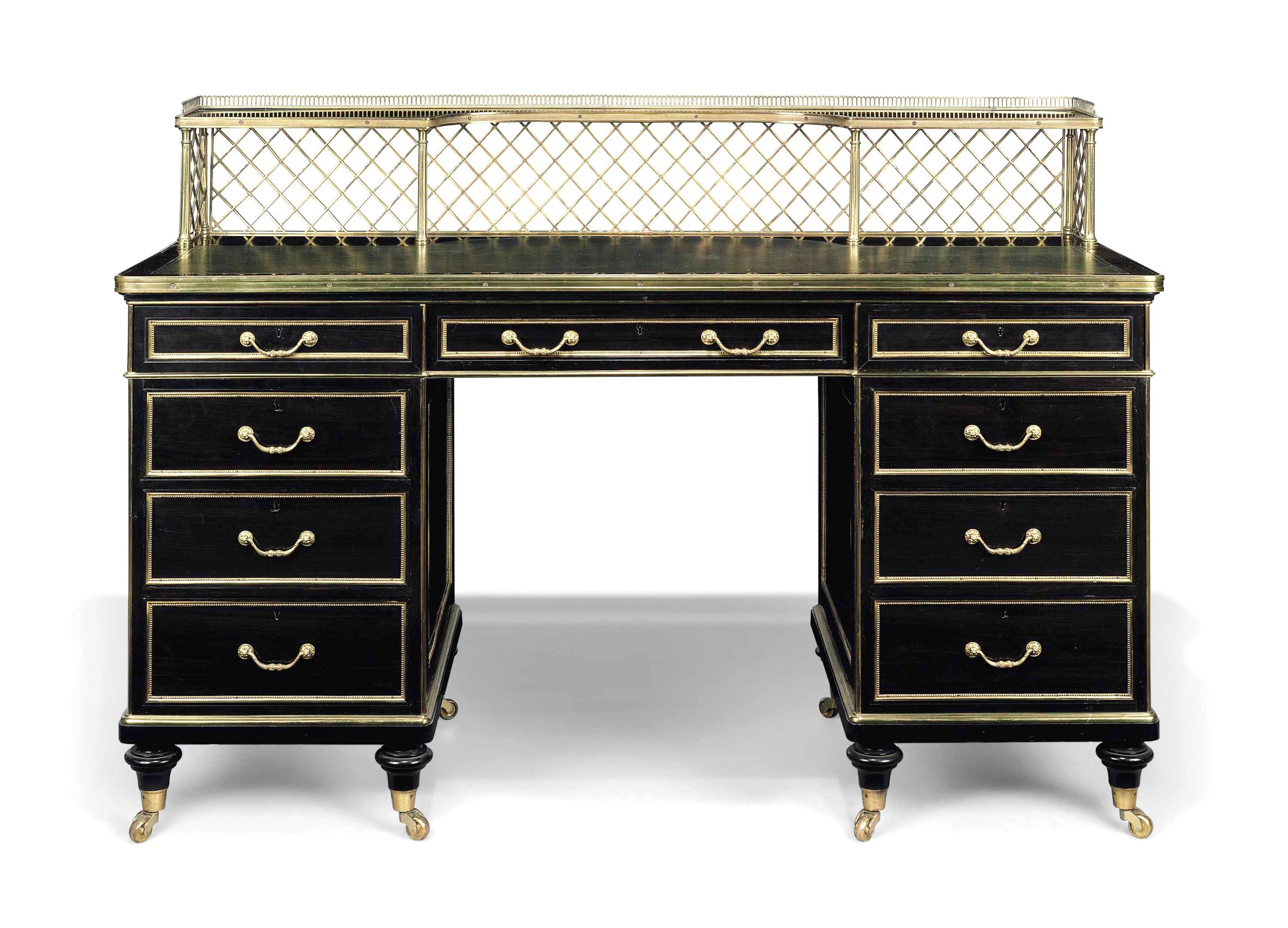 A VICTORIAN EBONY KNEE-HOLE DESK