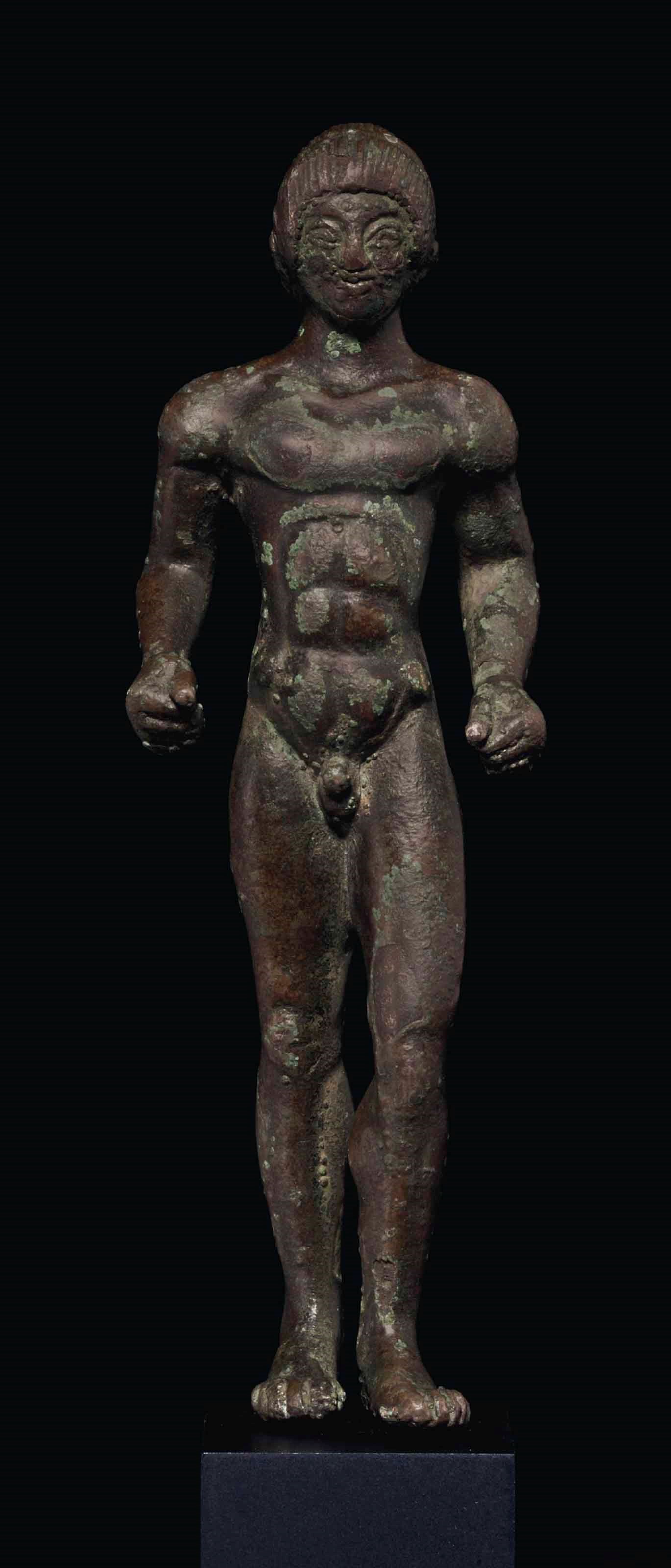 AN ETRUSCAN BRONZE KOUROS