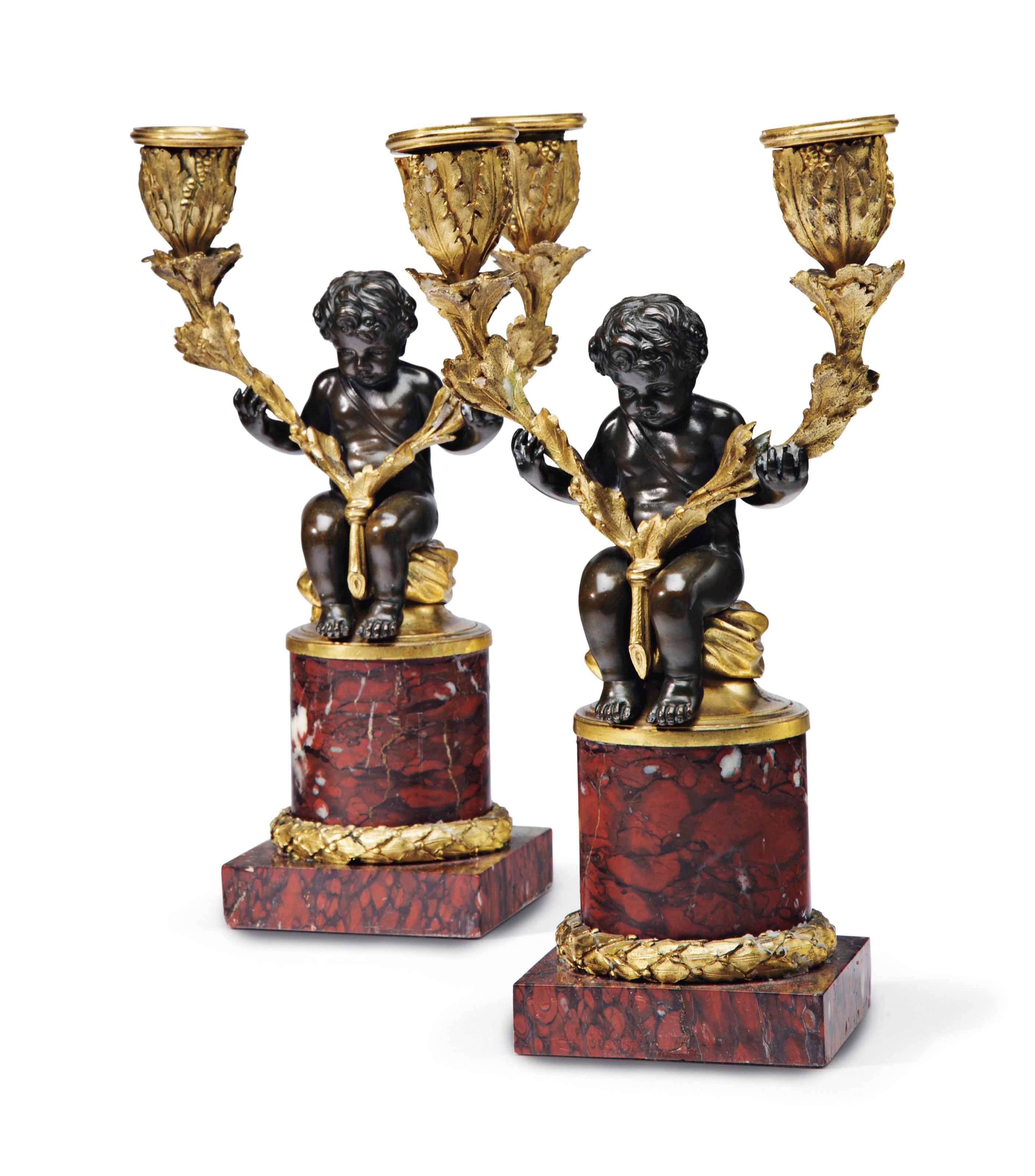 A PAIR OF LOUIS XVI STYLE ORMOLU-MOUNTED, PATINATED BRONZE AND ROUGE GRIOTTE MARBLE CANDELABRA