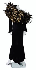 A BLACK JERSEY AND FEATHER-EMBELLISHED LONG-SLEEVED GOWN