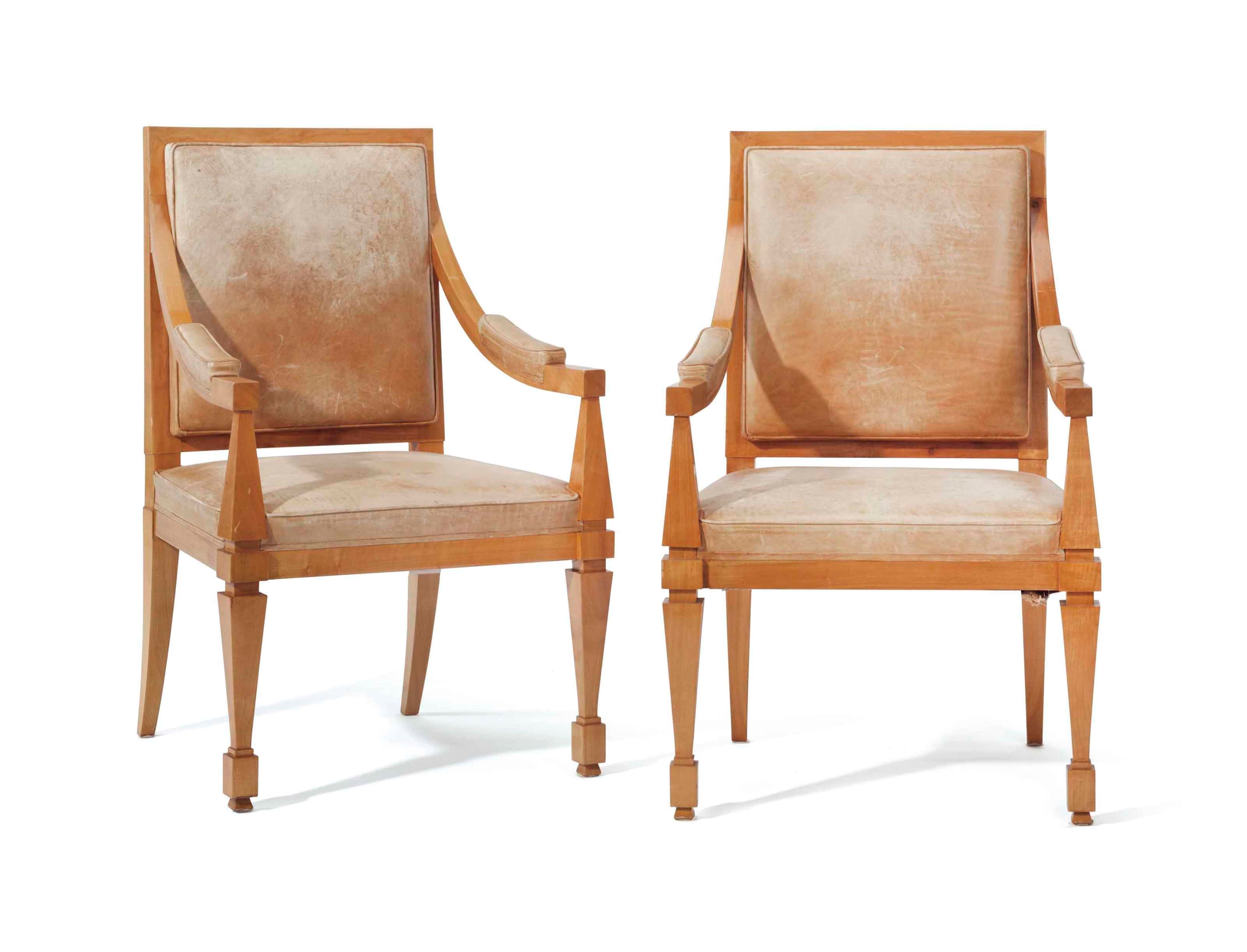 A PAIR OF FRENCH SYCAMORE AND LEATHER ARMCHAIRS