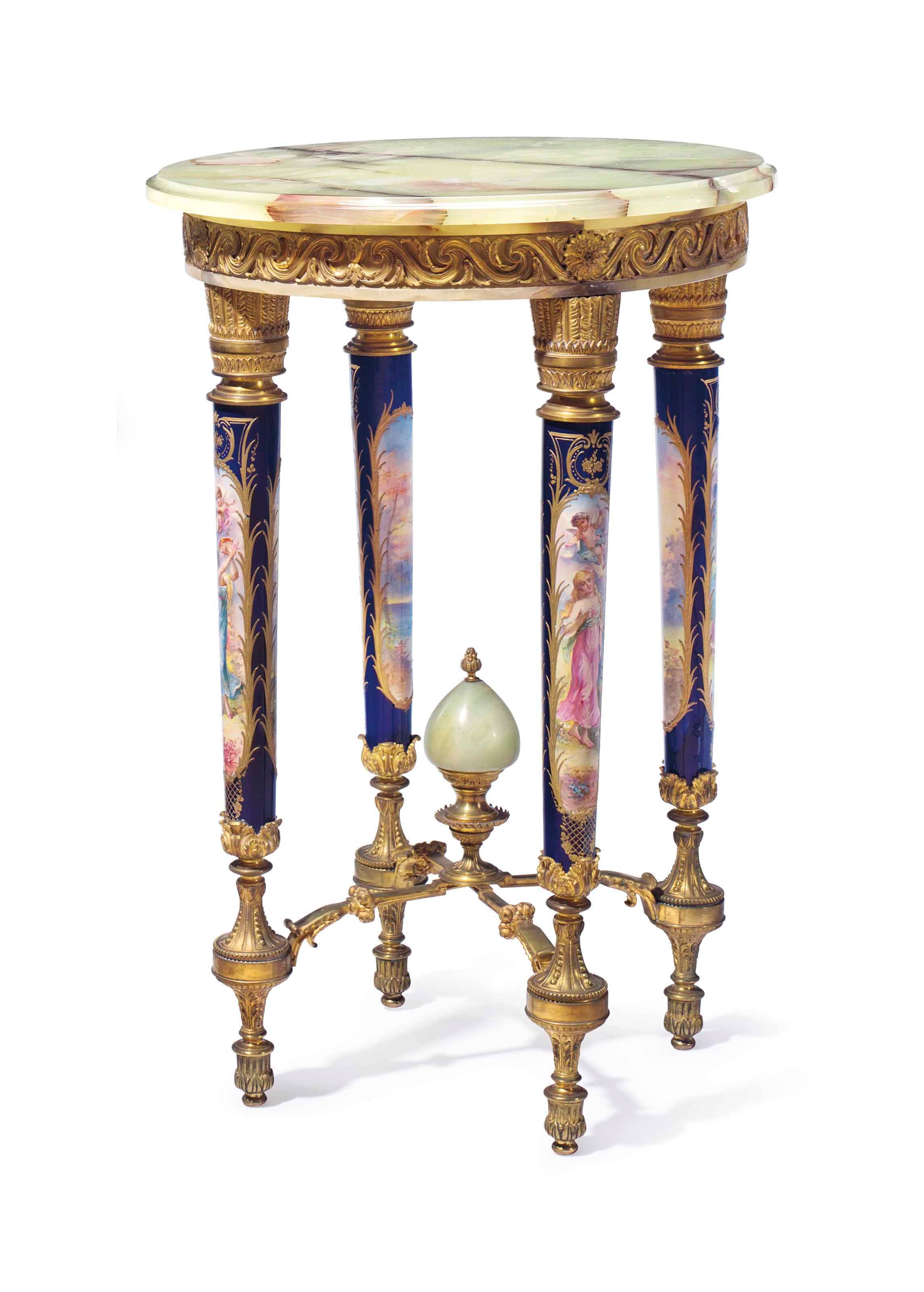 A FRENCH ORMOLU, SEVRES STYLE PORCELAIN AND ONYX GUERIDON