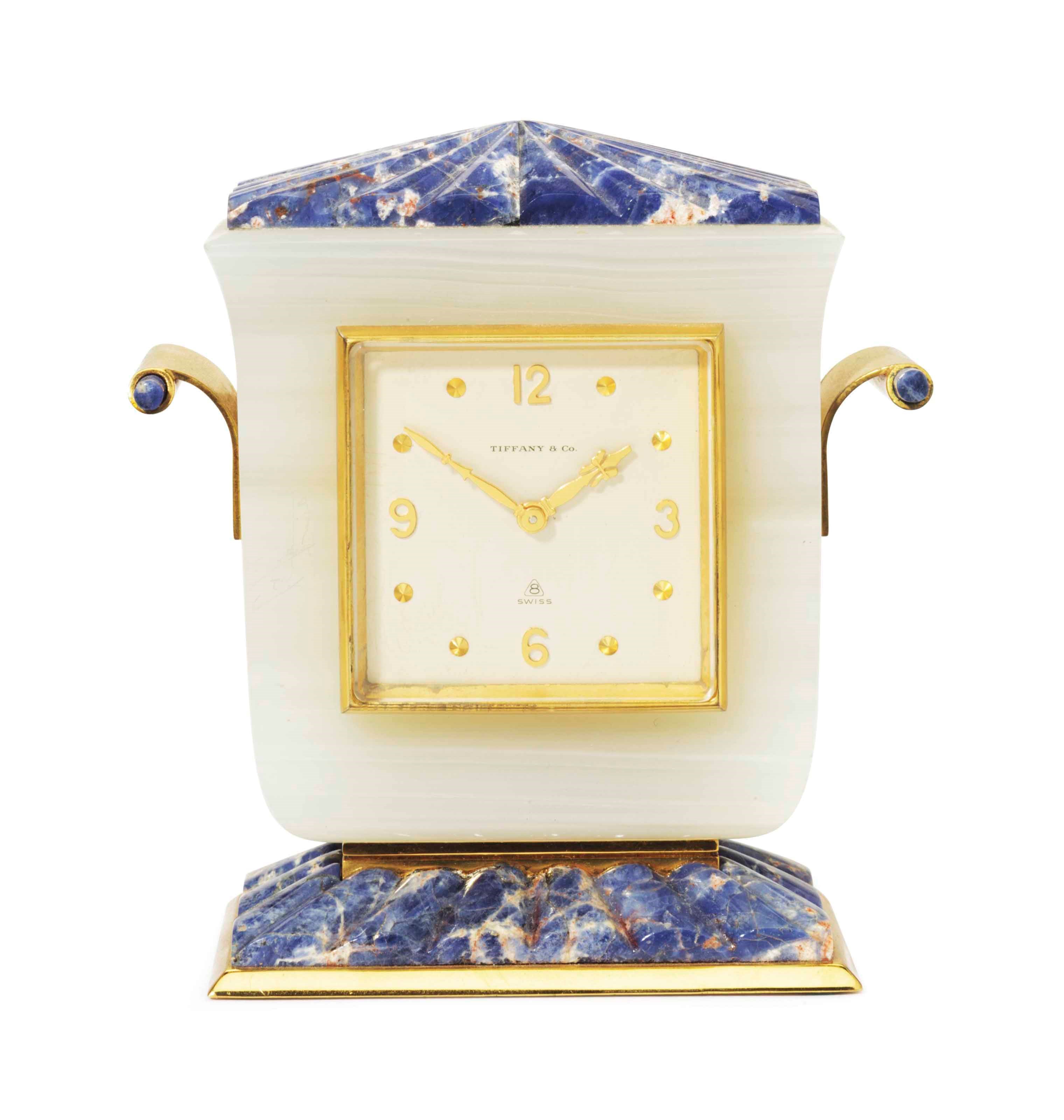 AN AMERICAN GILT-METAL MOUNTED AGATE AND SODALITE TABLE CLOCK