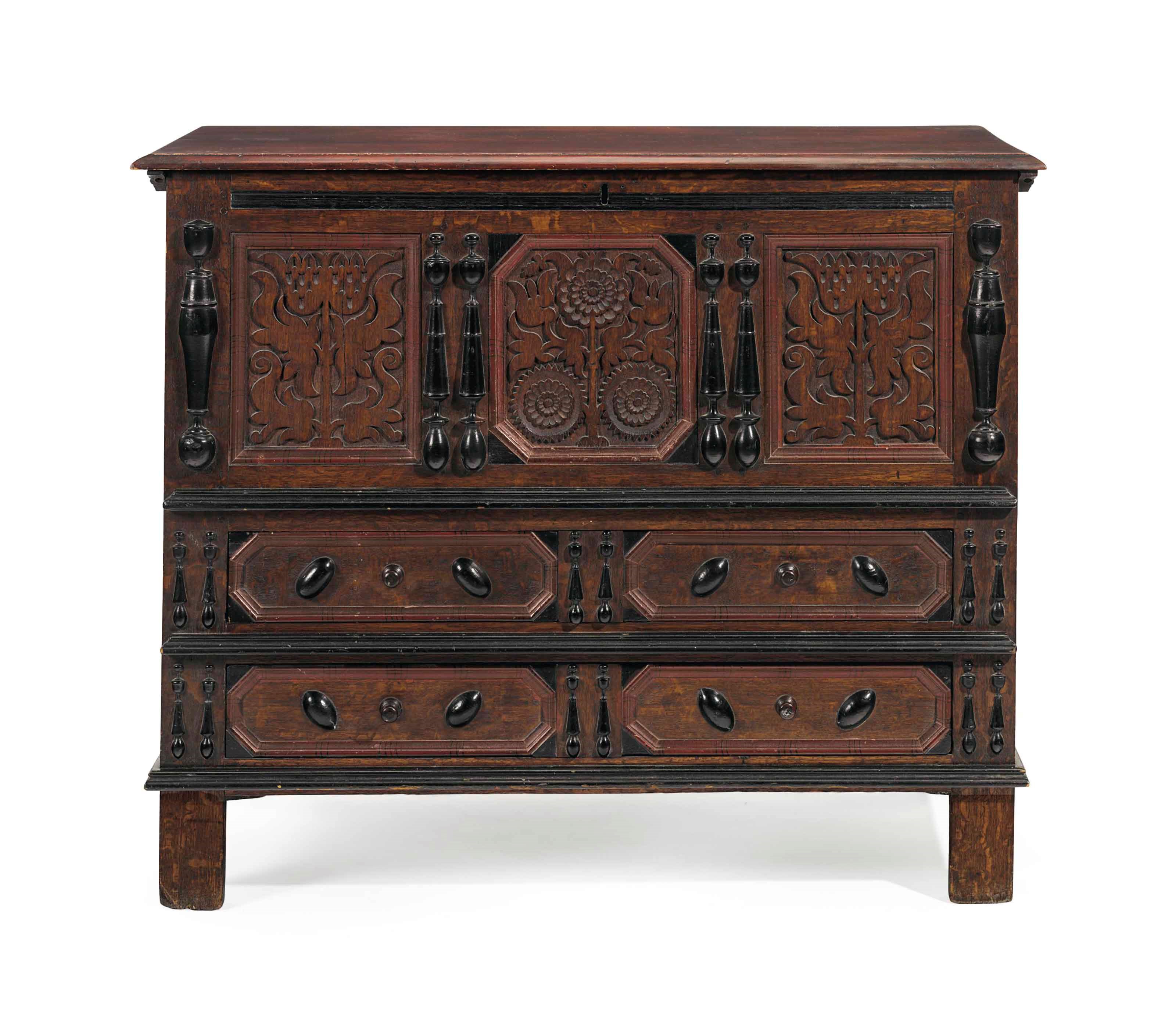 A JOINED AND PAINTED OAK CARVED "SUNFLOWER" CHEST WITH TWO DRAWERS