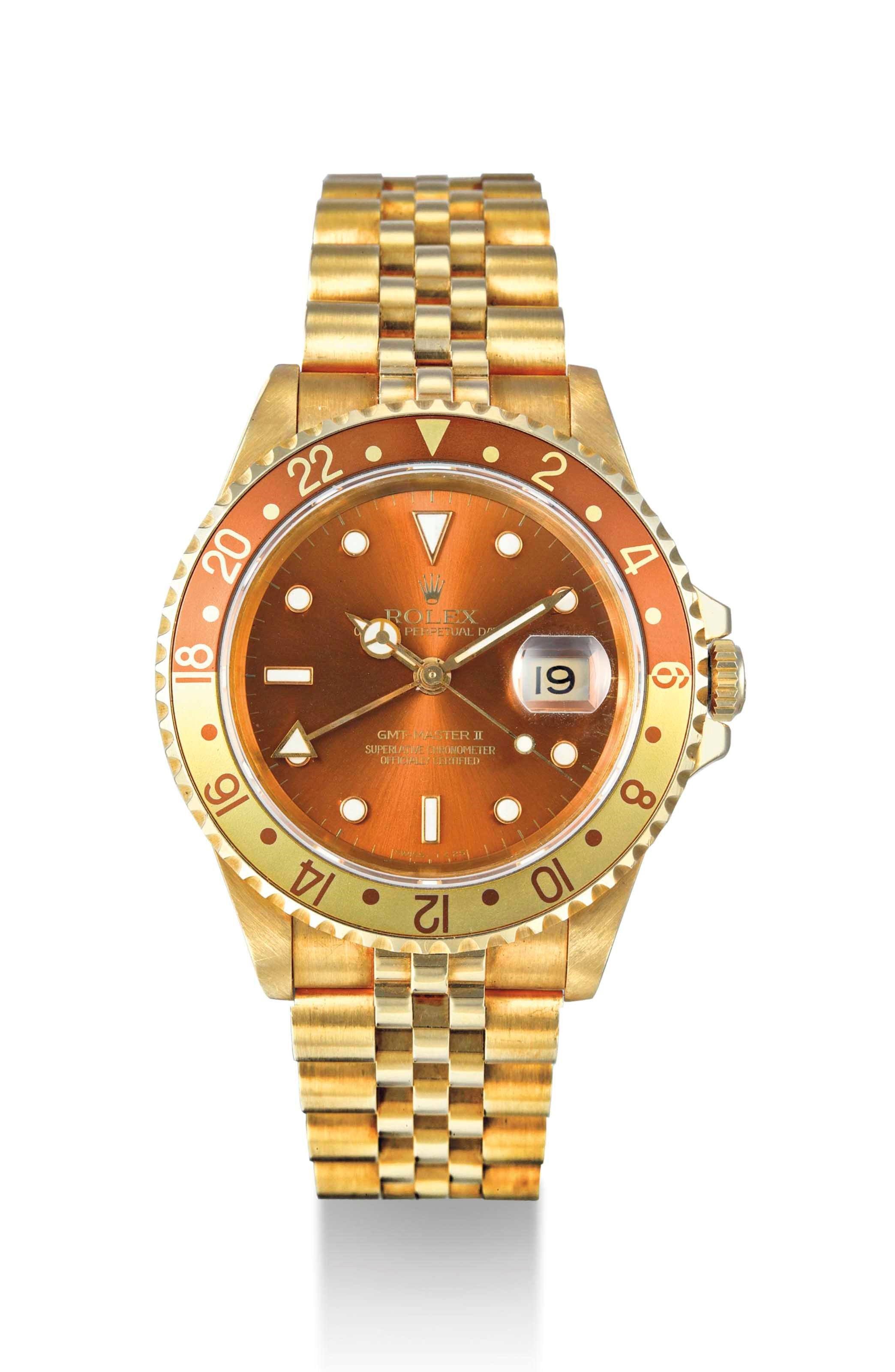 ROLEX. AN 18K GOLD AUTOMATIC DUAL TIME WRISTWATCH WITH SWEEP CENTRE SECONDS, DATE AND BRACELET