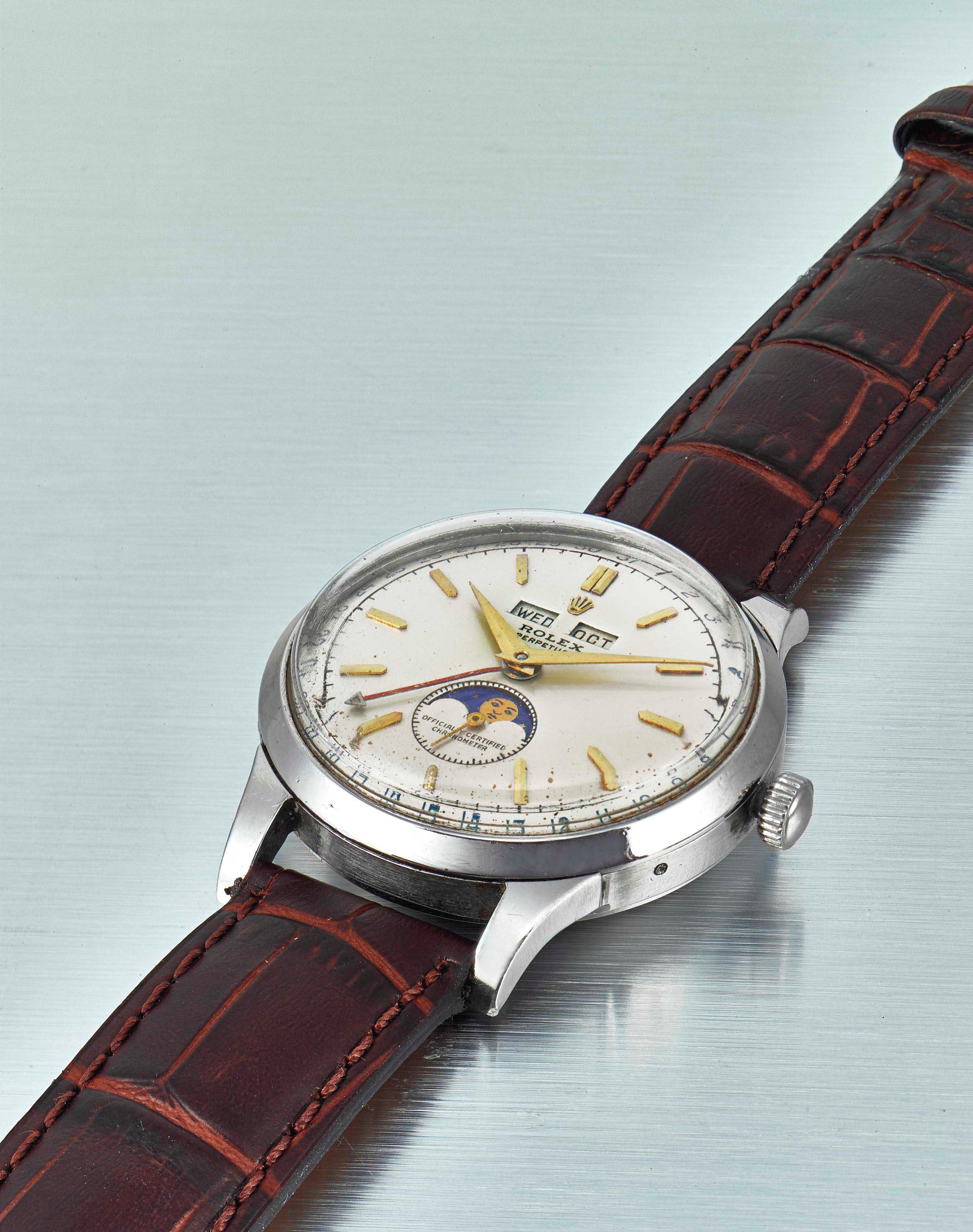 ROLEX. A STAINLESS STEEL AUTOMATIC TRIPLE CALENDAR WRISTWATCH WITH MOON PHASES
