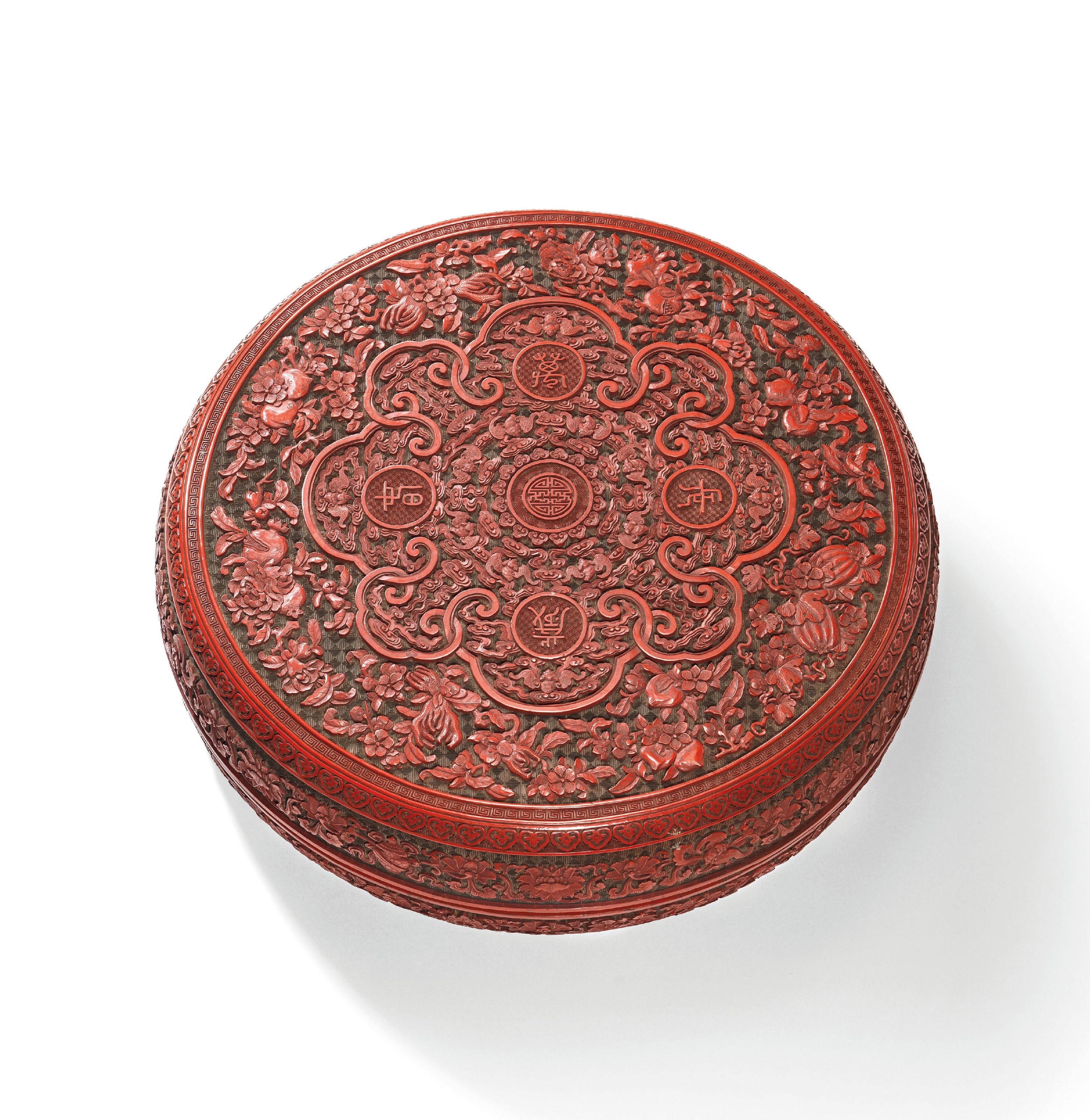 A LARGE CARVED CINNABAR LACQUER ‘LONGEVITY’ BOX AND COVER