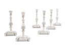A SET OF FOUR DUTCH SILVER CANDLESTICKS AND A PAIR TO MATCH