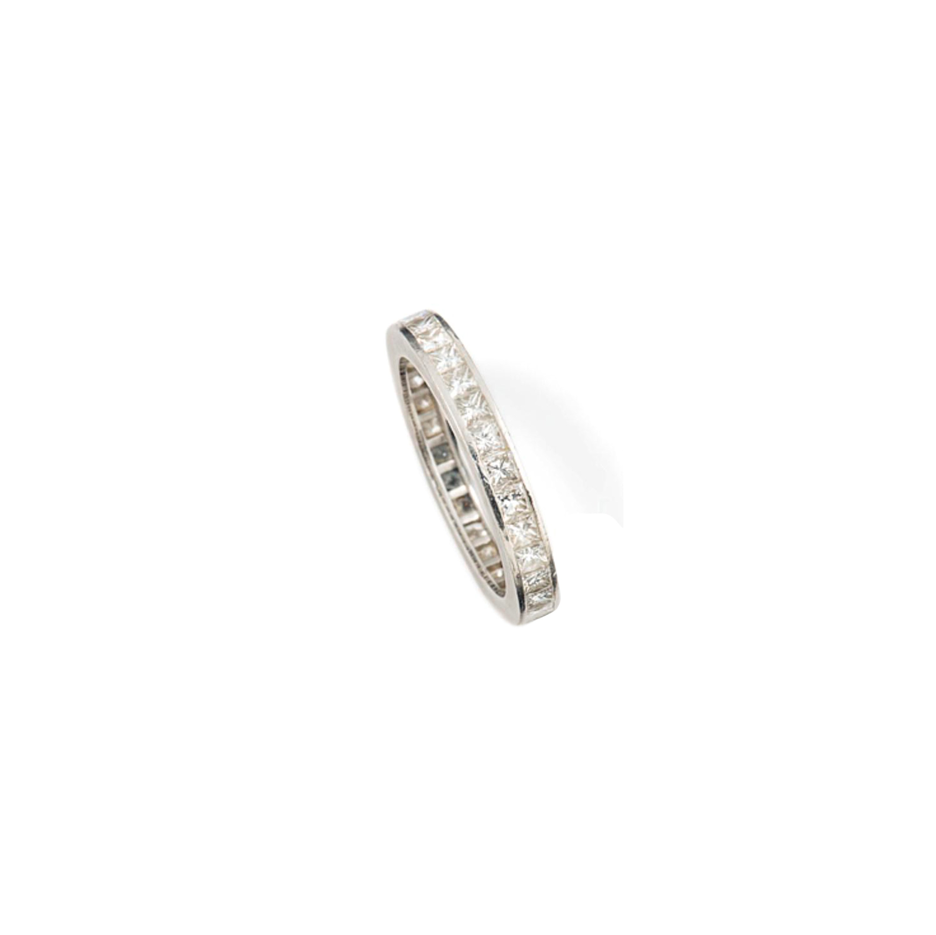 A PLATINUM AND DIAMOND ETERNITY RING, BY CARTIER